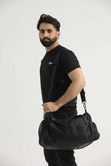 Man carrying a Splash30 gym duffle bag in everyday use