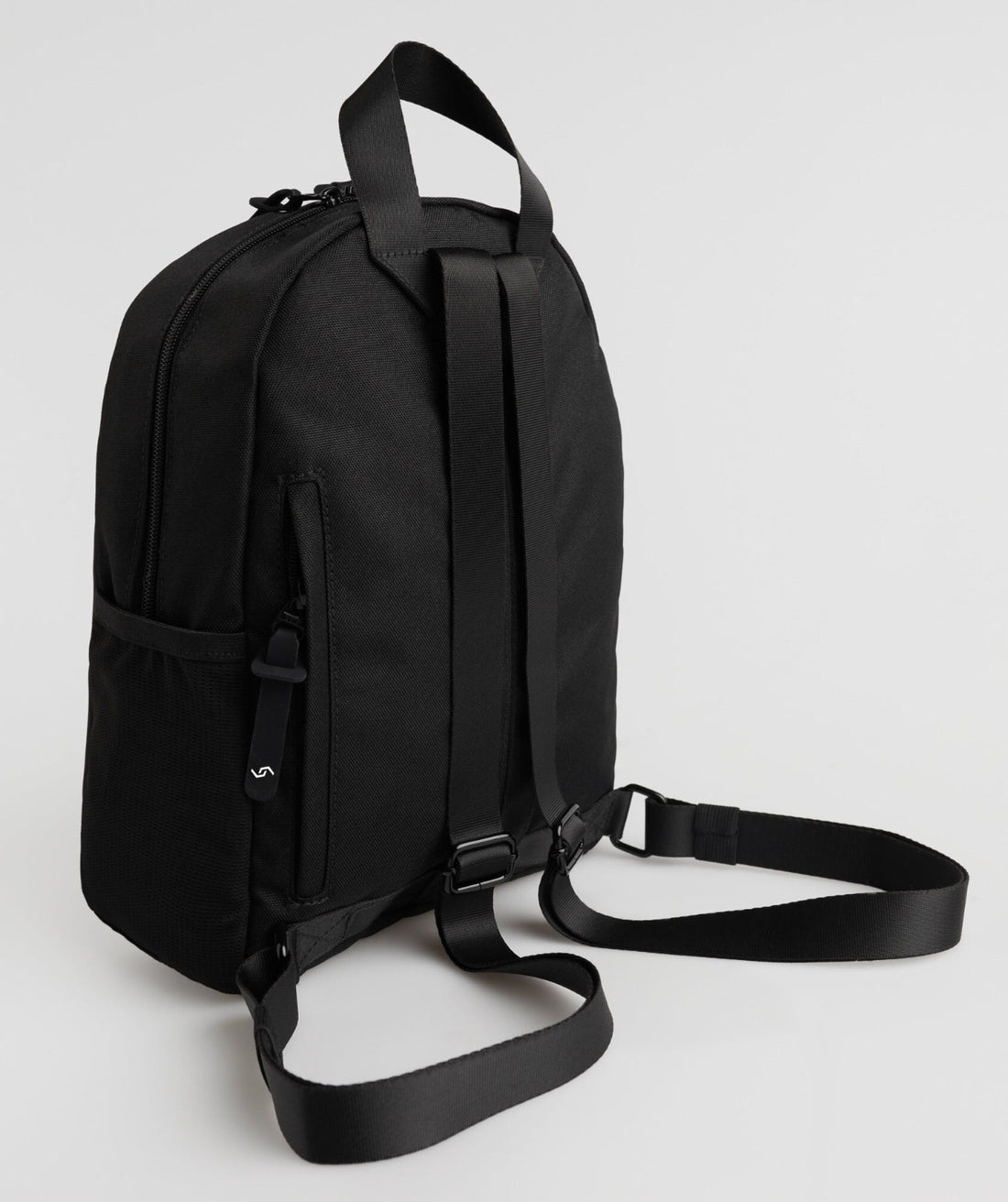 Black backpack with 'SPLASH 30' text on a light gray background