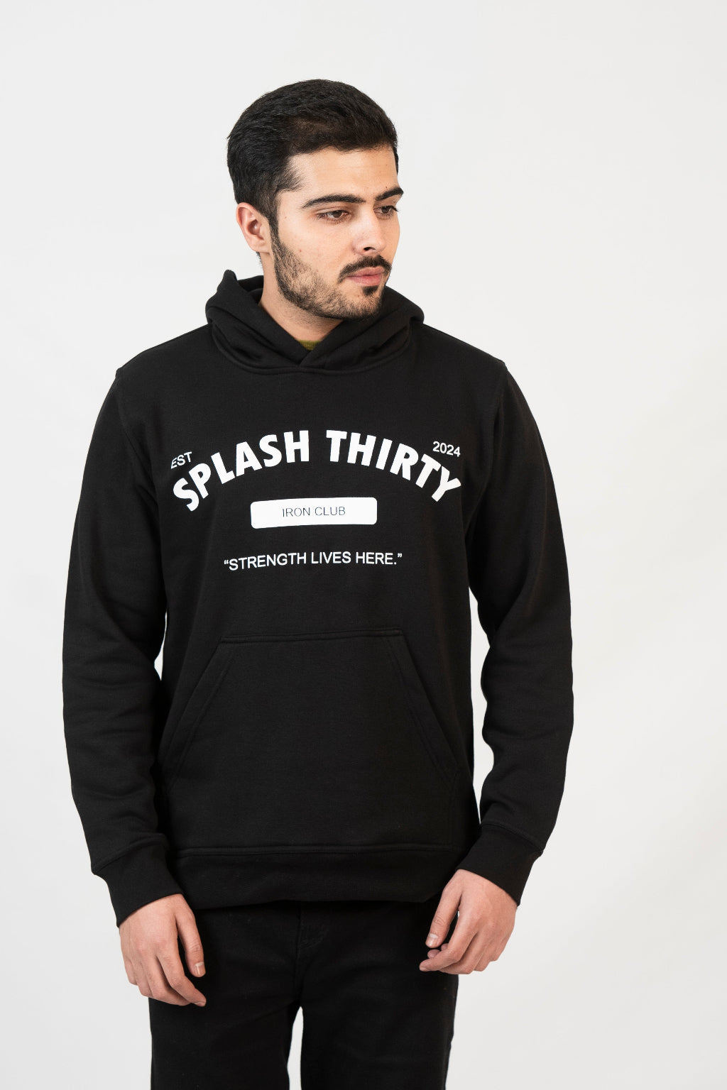 Man wearing a black hoodie with text on a white background