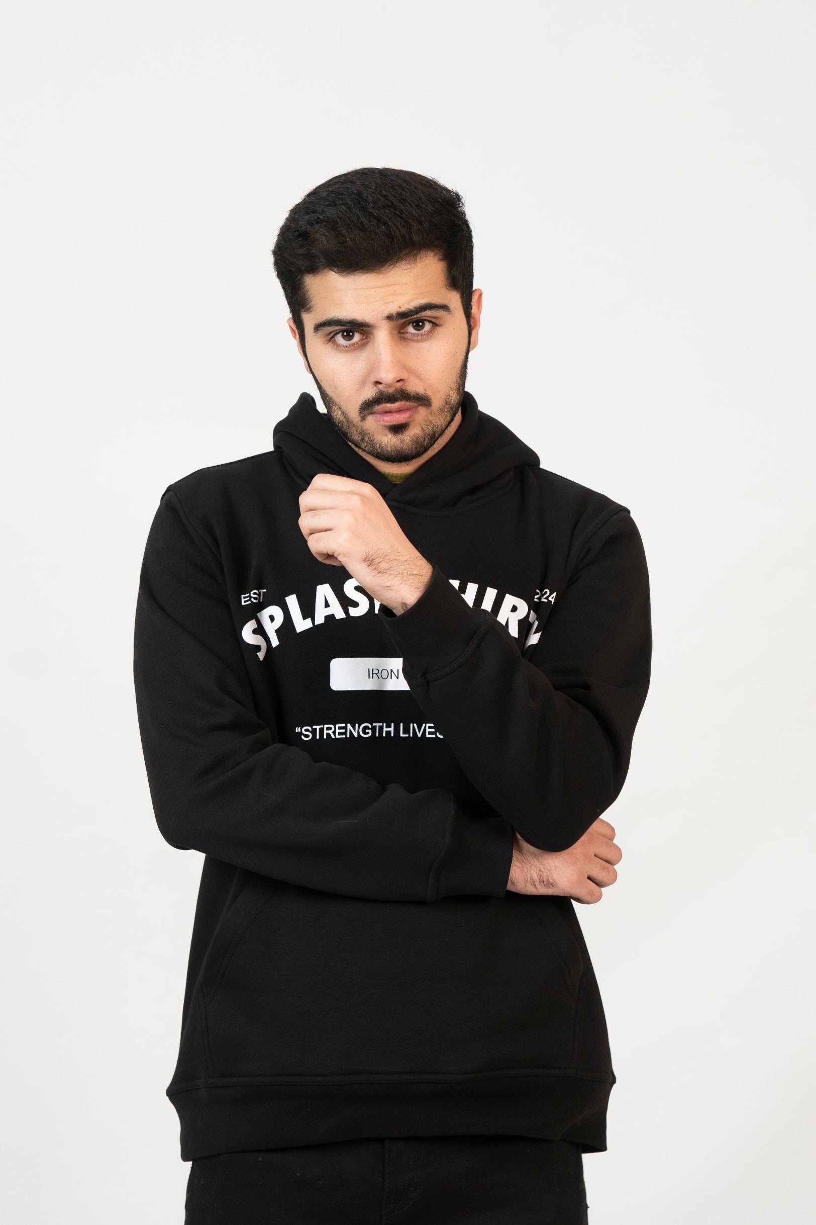 Man wearing a black hoodie with text on a white background