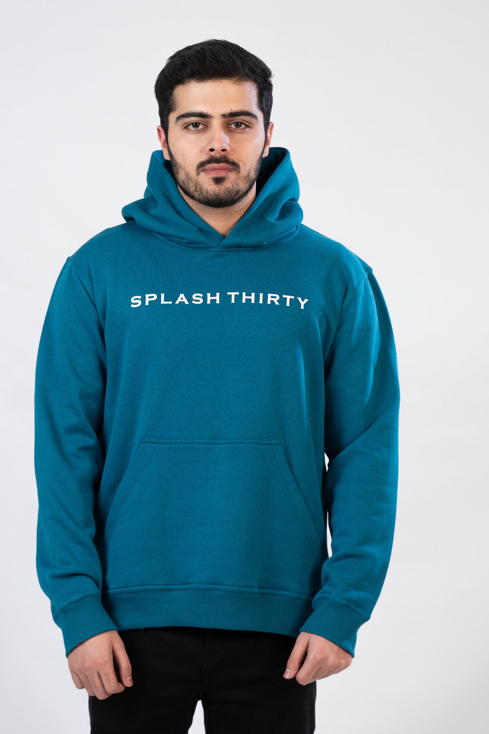 Man wearing a teal hoodie with 'Splash Thirty' text on a white background