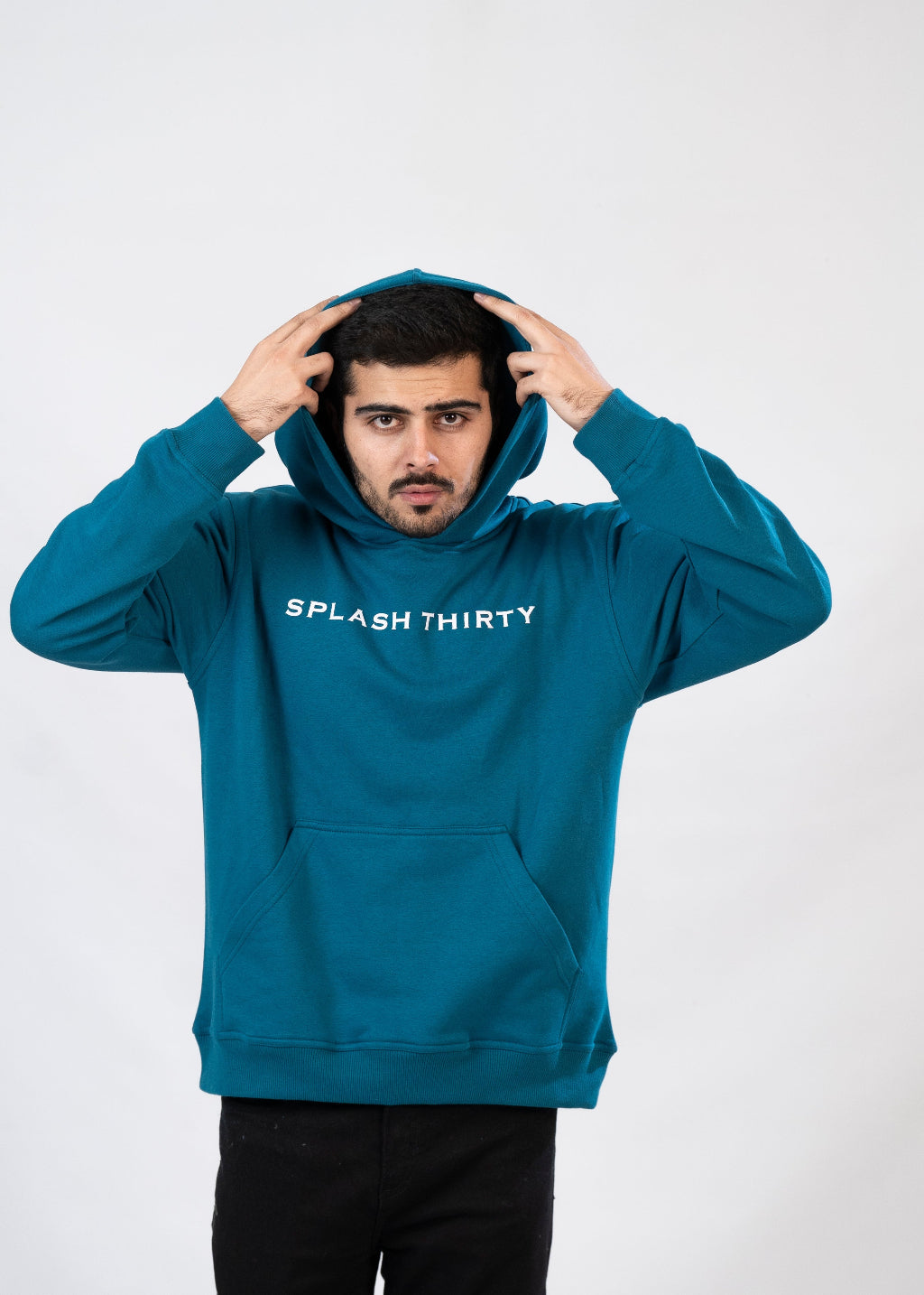 Person wearing a teal hoodie with 'Splash Thirty' text on a white background