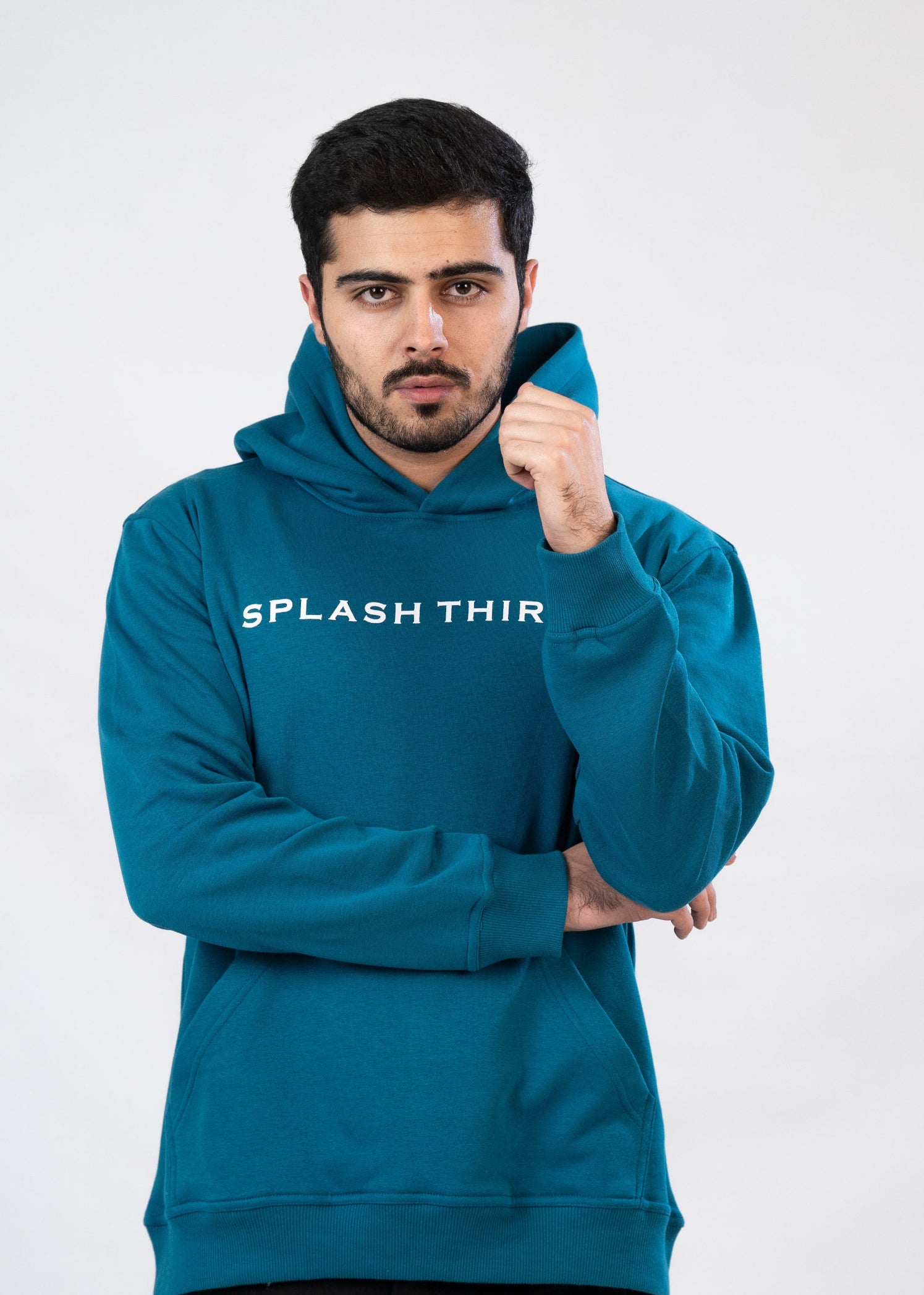 Man wearing a teal hoodie with 'Splash Thir' text on a white background