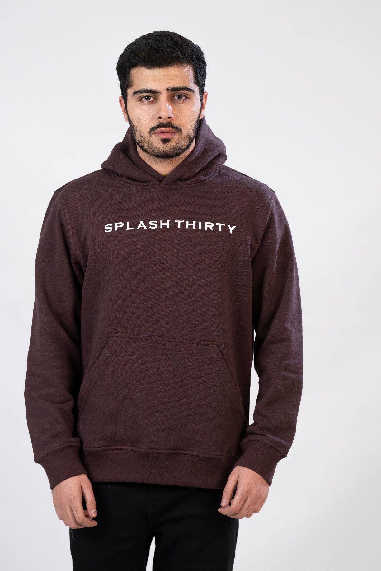 Man wearing a brown hoodie with 'Splash Thirty' text on a white background