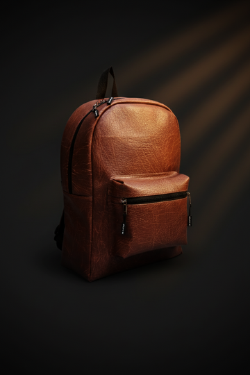Brown backpack on a dark background