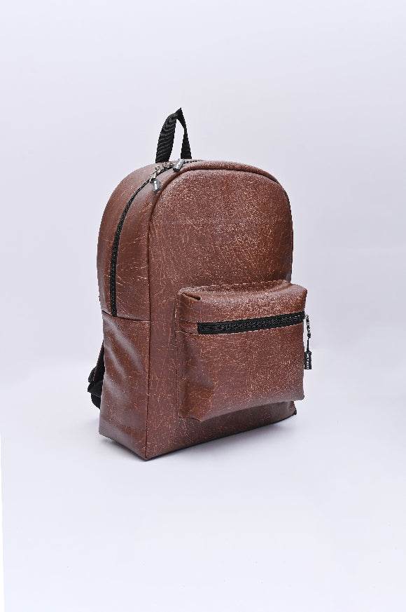 Brown backpack on a dark background