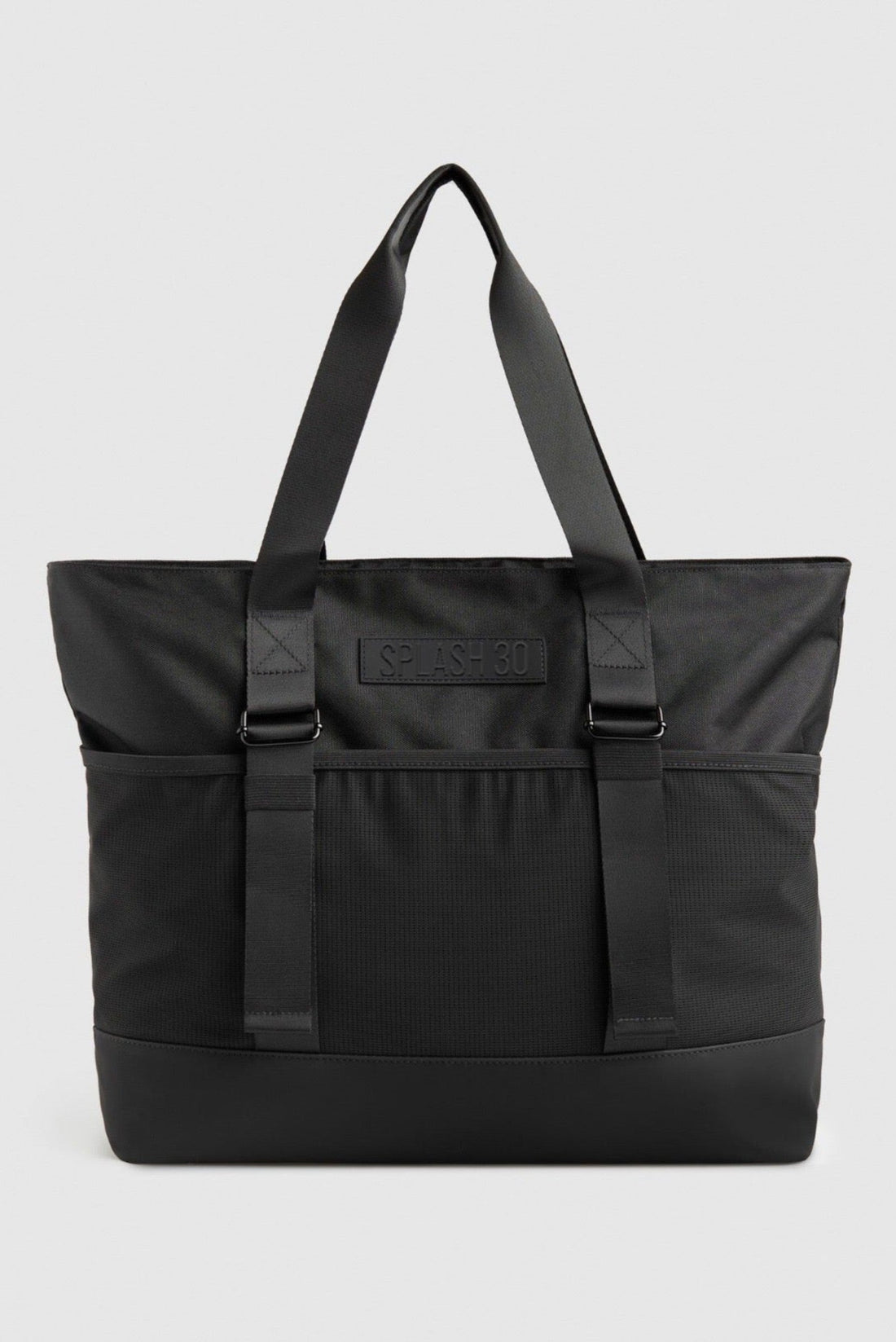 Black tote bag with a visible brand logo on a light gray background.