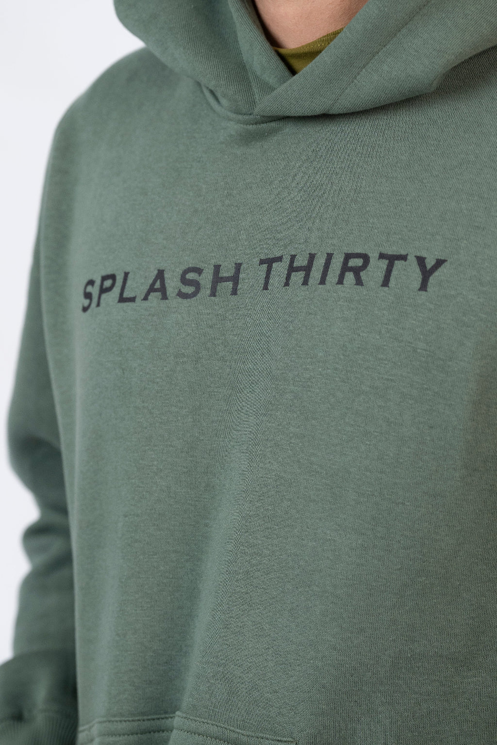 Green hoodie with 'Splash Thirty' text on a plain background