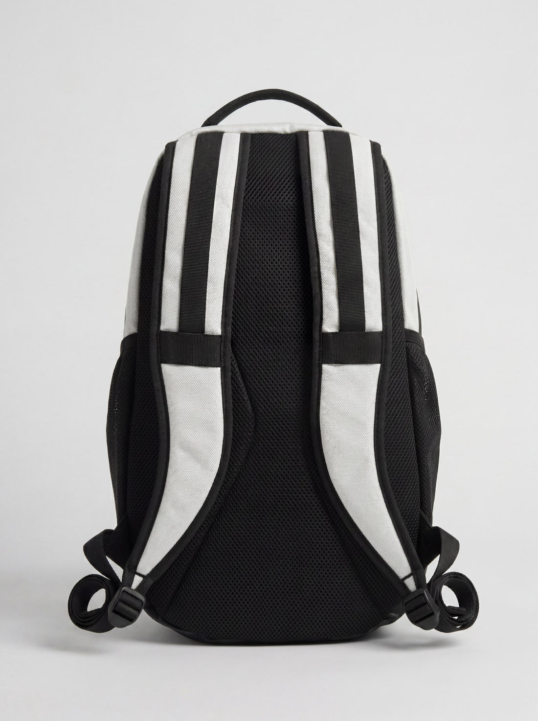 A white Splash everyday backpack with black straps and detailing, featuring multiple compartments and a logo on the front.