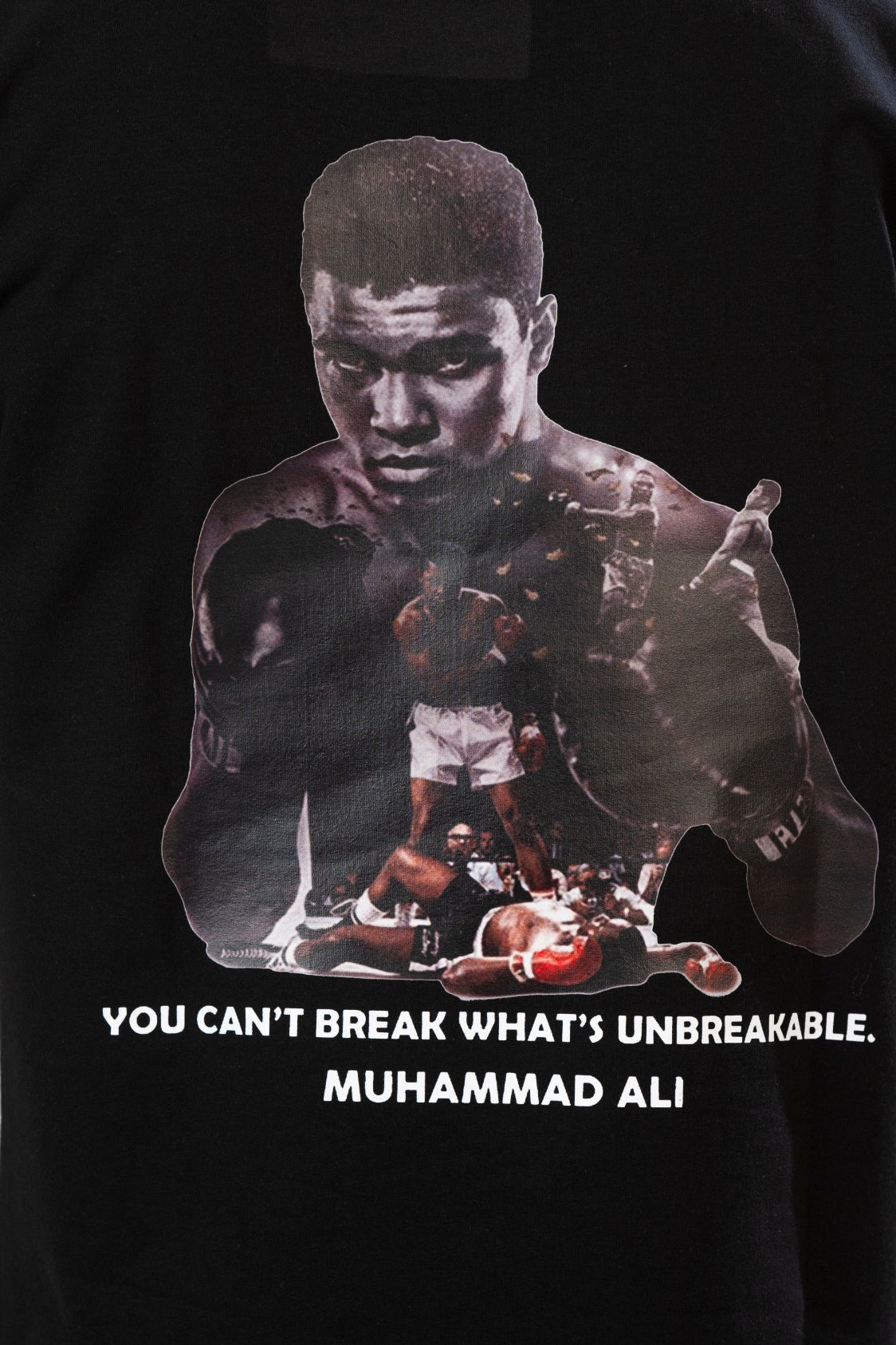 Black t-shirt with a graphic of Muhammad Ali and a quote on a black background