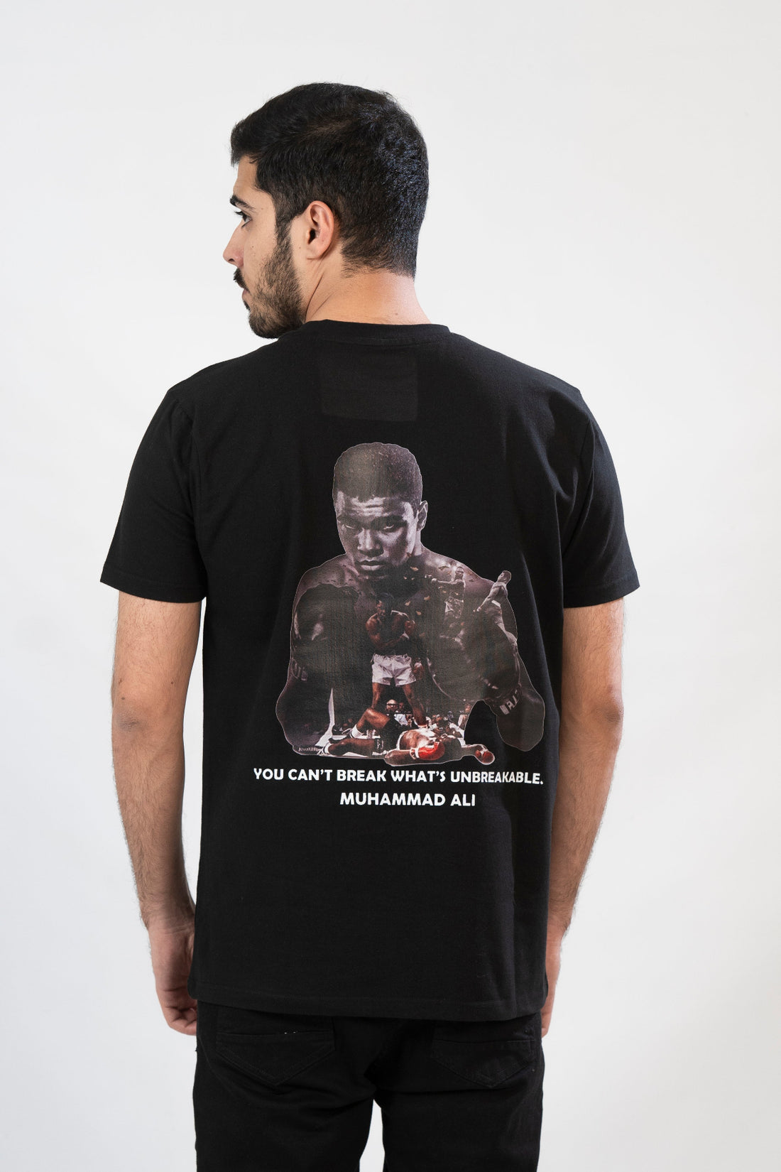 Black t-shirt with a graphic of Muhammad Ali and a quote on a black background