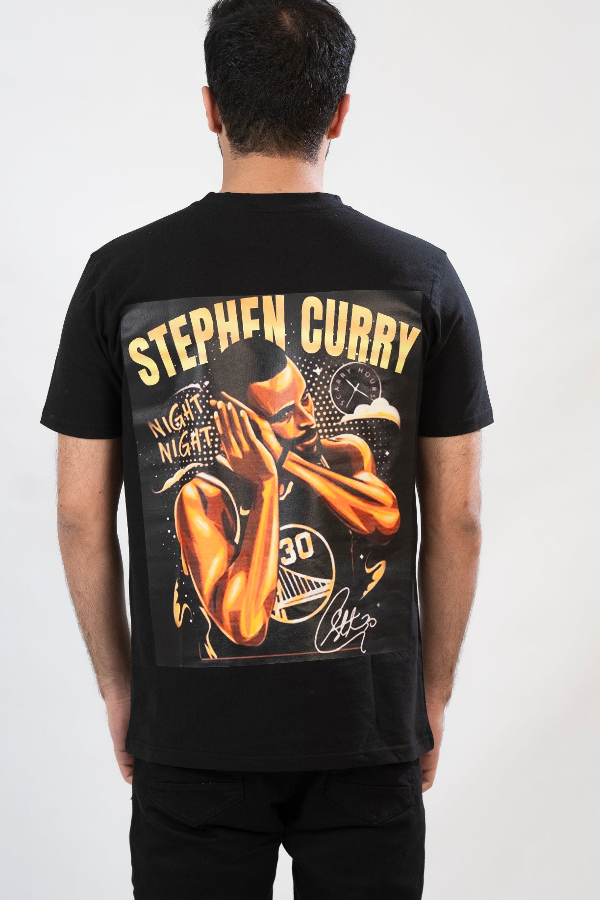A black t-shirt with a front graphic print of the basketball player Stephen Curry, with the text 'Stephen Curry' and the number '30' included.