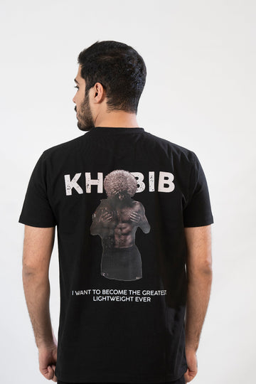 Person wearing a black t-shirt with 'KHOBIB' and graphic design on the back.