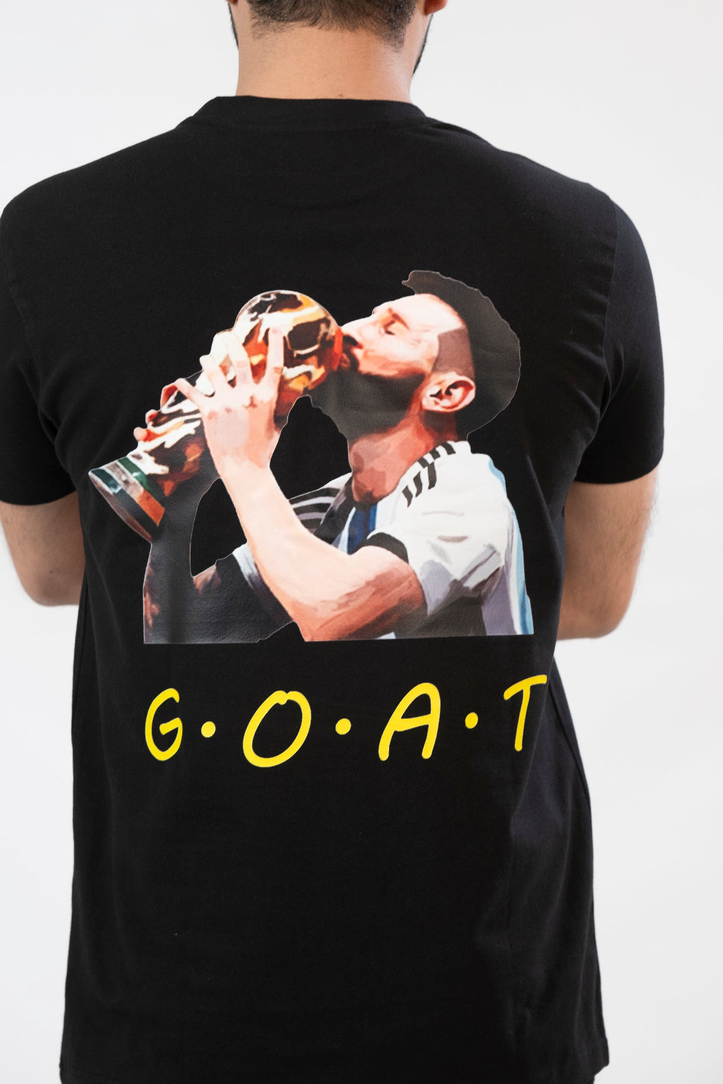 Black t-shirt with a graphic of a person drinking from a bottle and 'G.O.A.T.' text on a white background