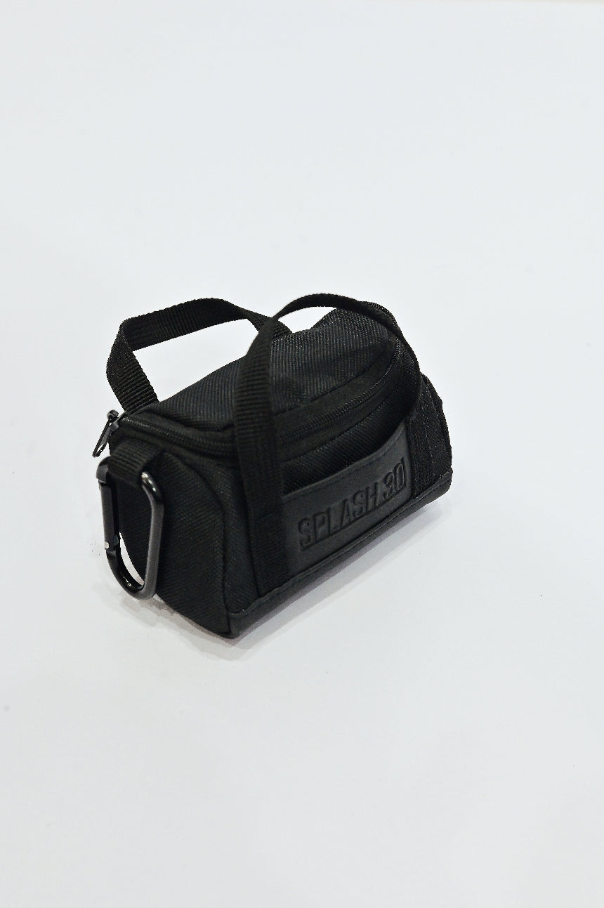 Black duffel bag with 'Splash' branding on a light gray background