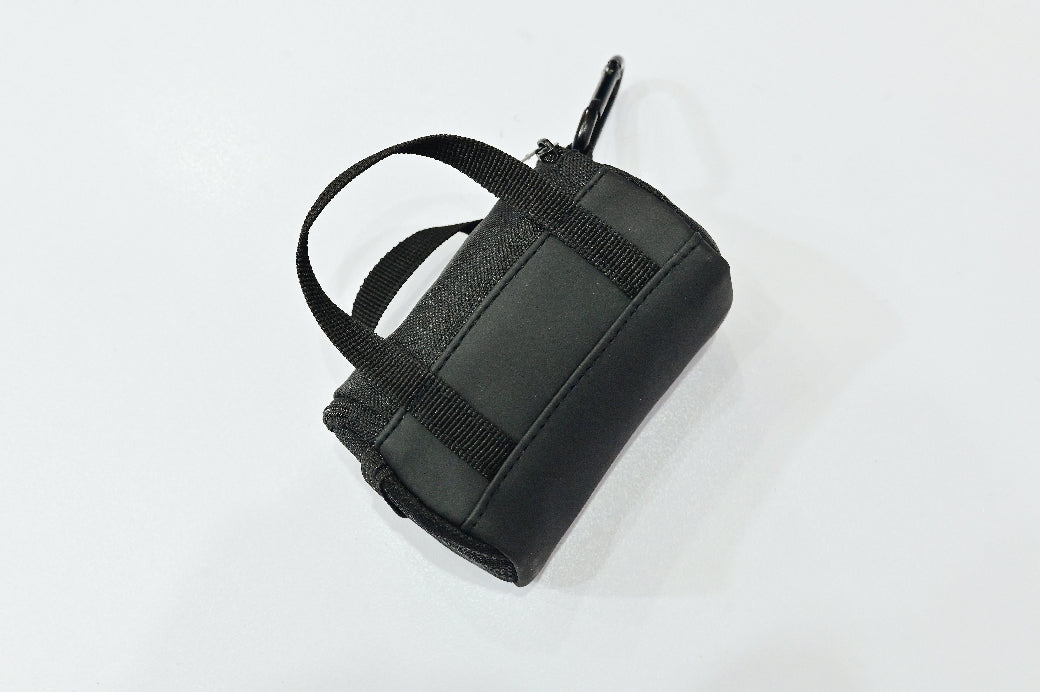 Black leather bag with a strap on a white background