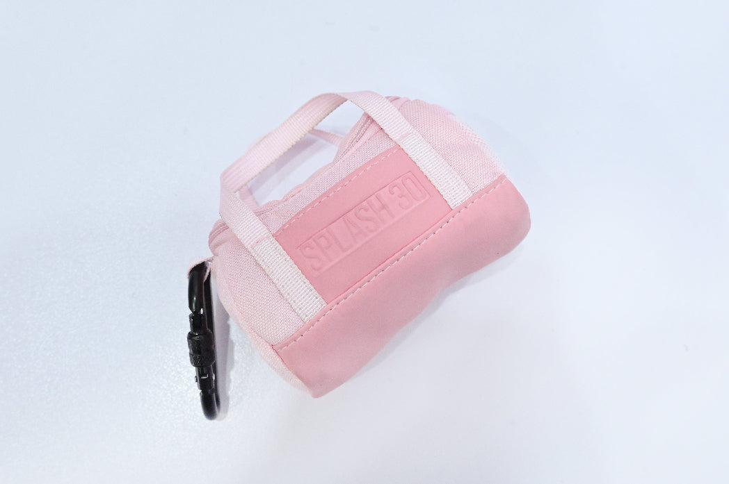 Pink pet carrier with a clear window on a light gray background