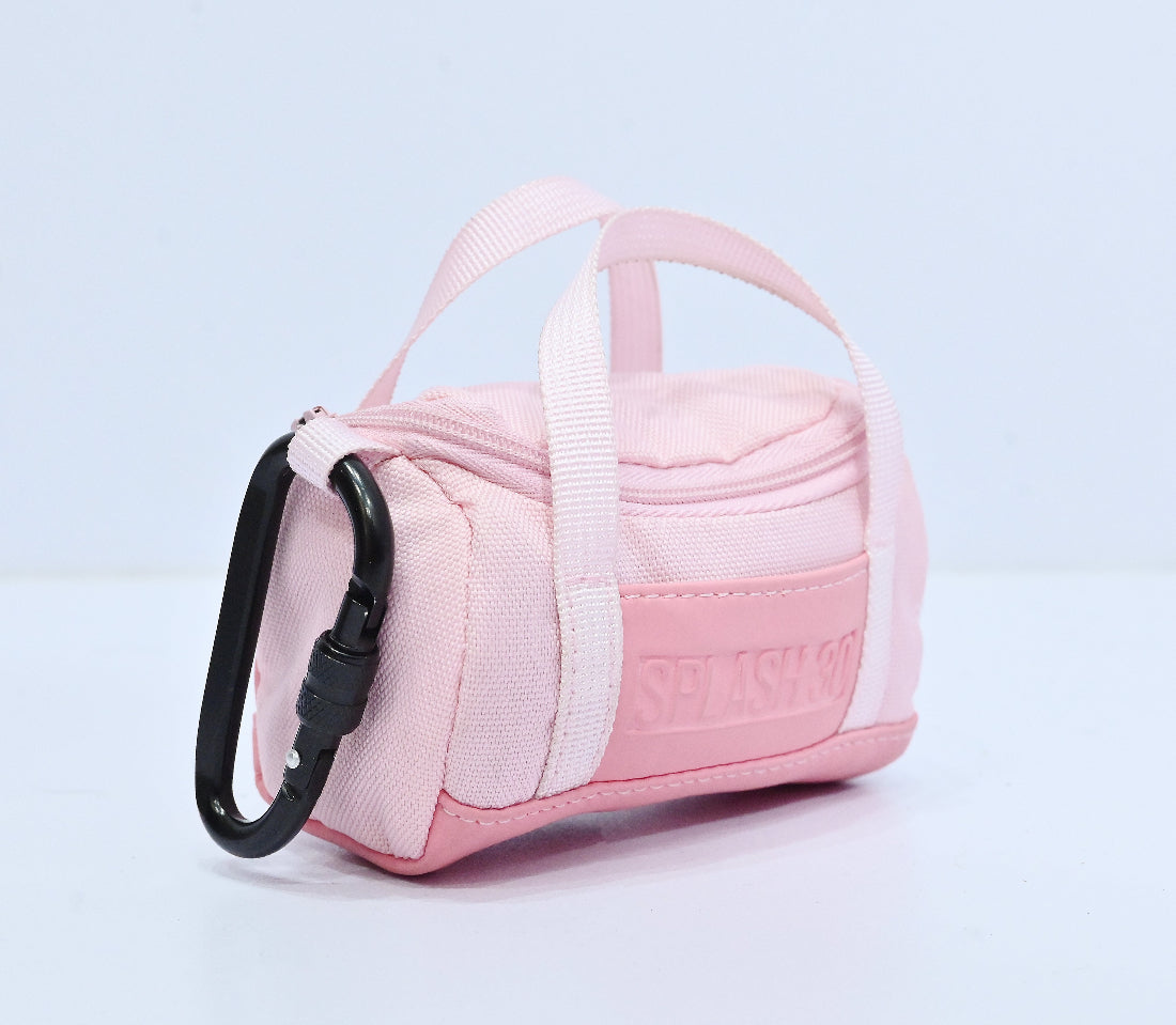 Pink pet carrier with a clear window on a light gray background