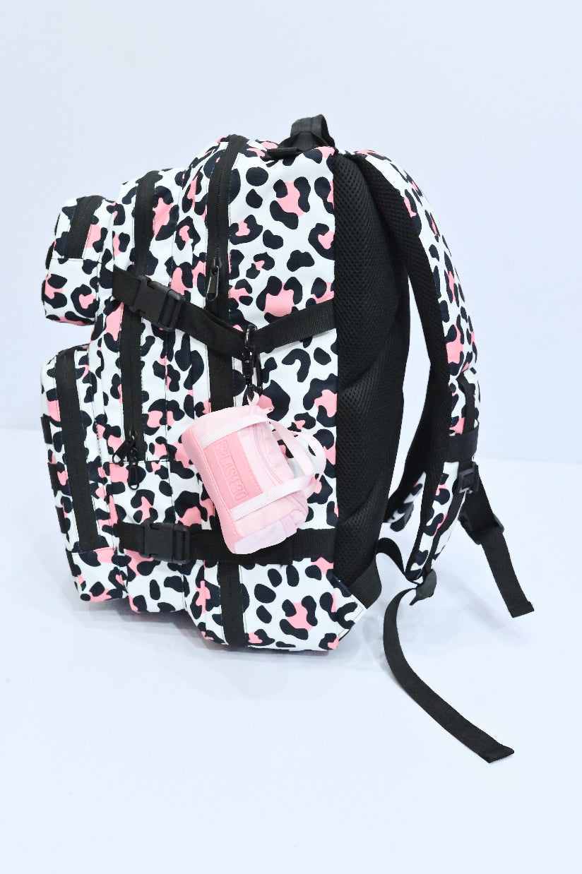 Leopard print backpack with pink accents on a light gray background