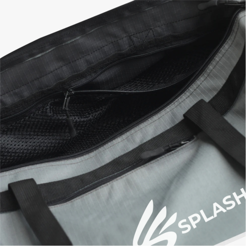 A gray polyester duffel bag with a logo on the side, featuring two black straps and multiple zippered compartments.