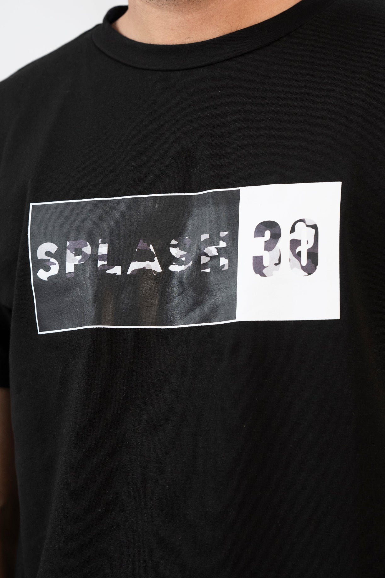 Black t-shirt with 'Splash 30' graphic design on a plain background
