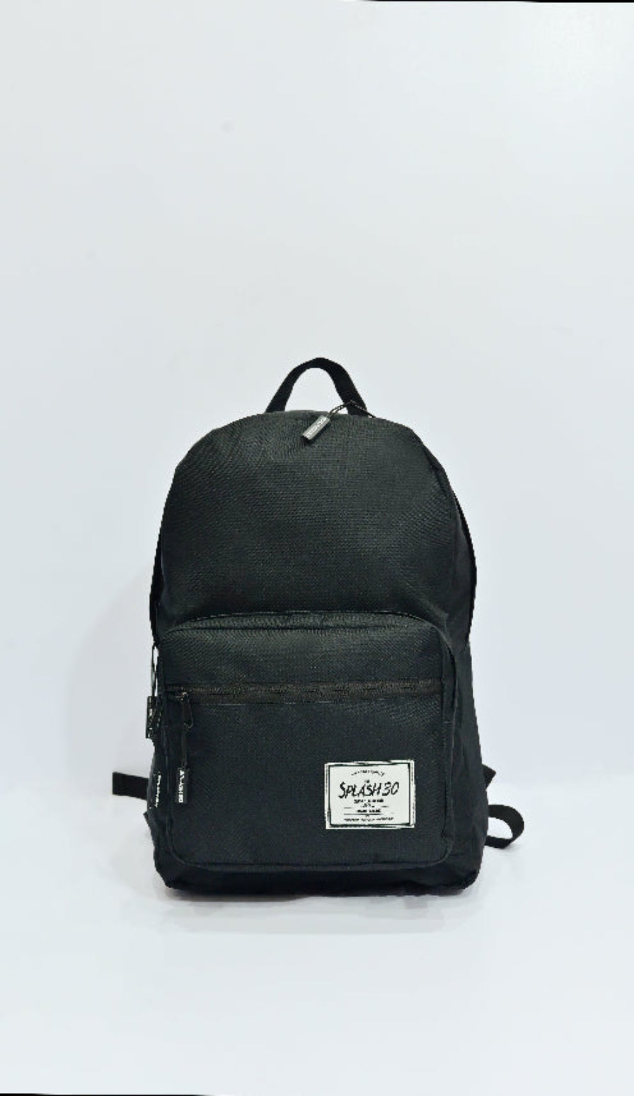 Black backpack with a visible brand label on a white background