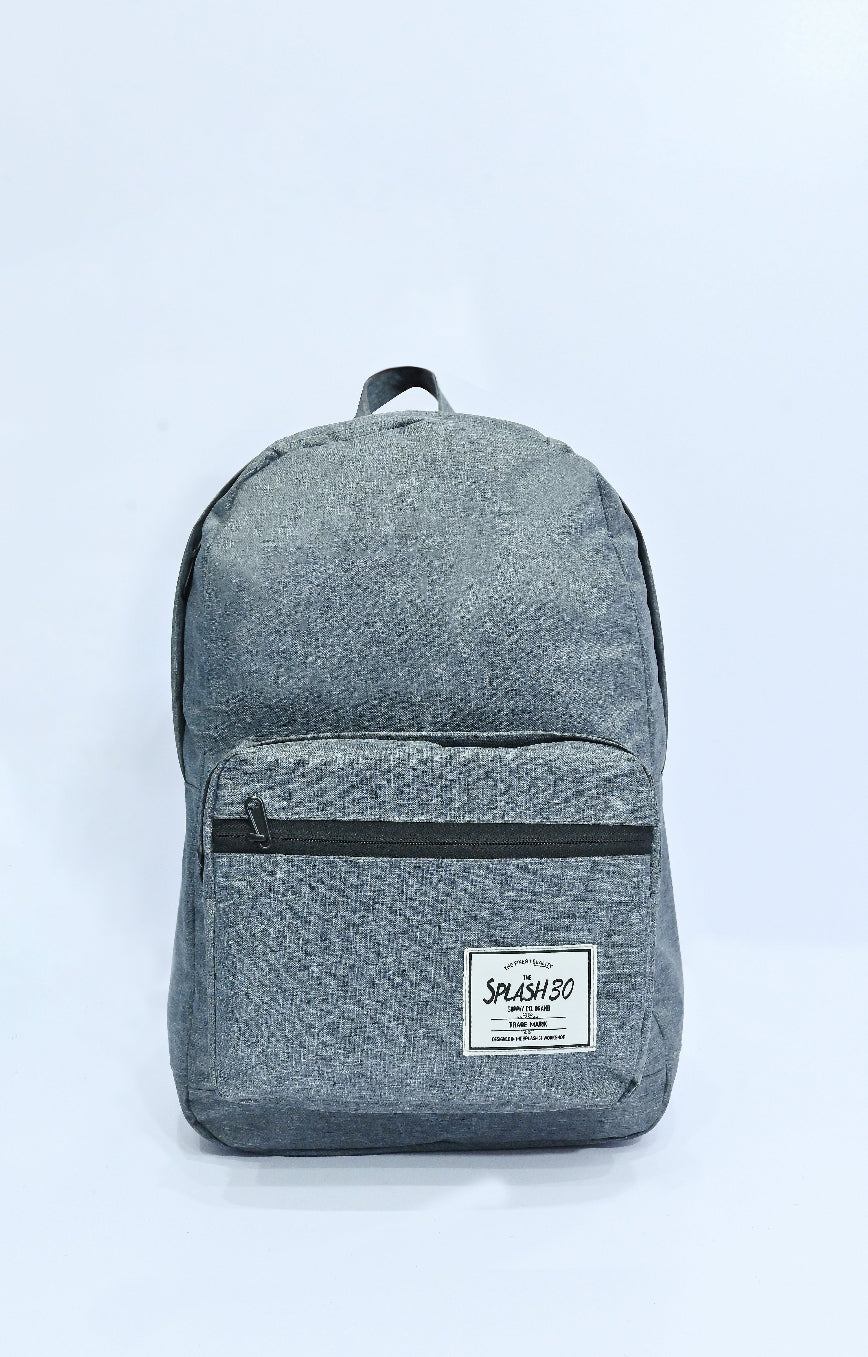 Gray backpack with a visible brand label on a light blue background