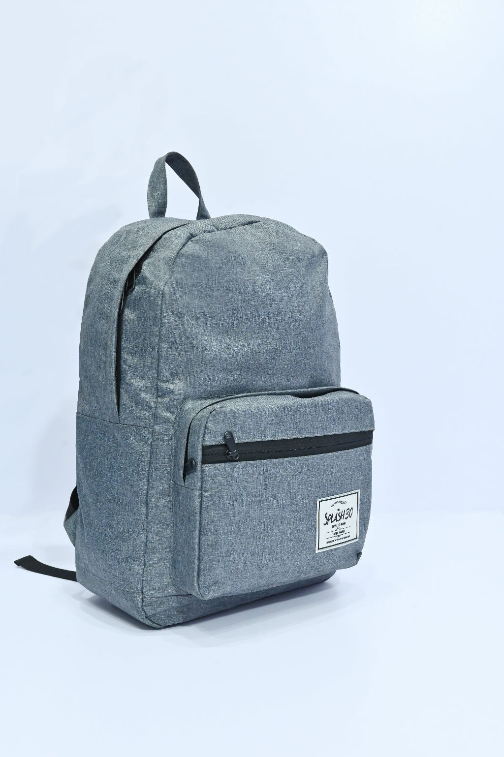 Gray backpack with a visible brand label on a light blue background