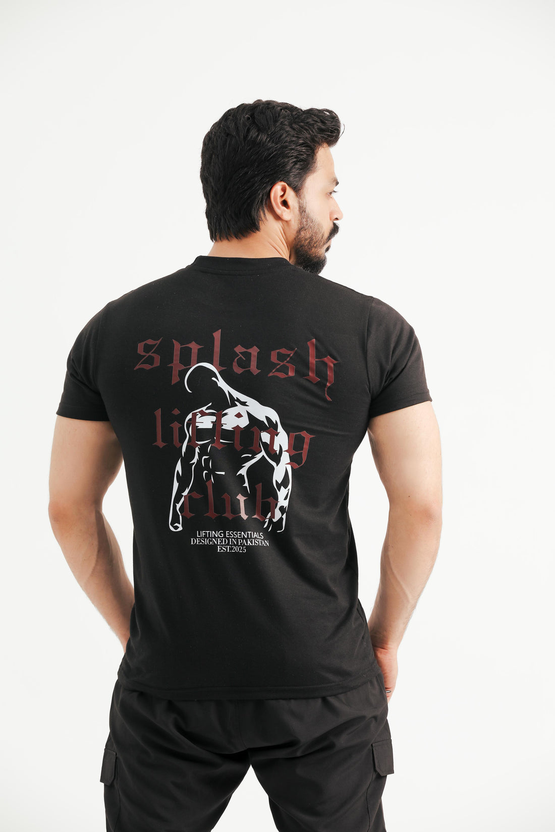 A person wearing a black t-shirt with 'splash lifting' text and a graphic on the back.