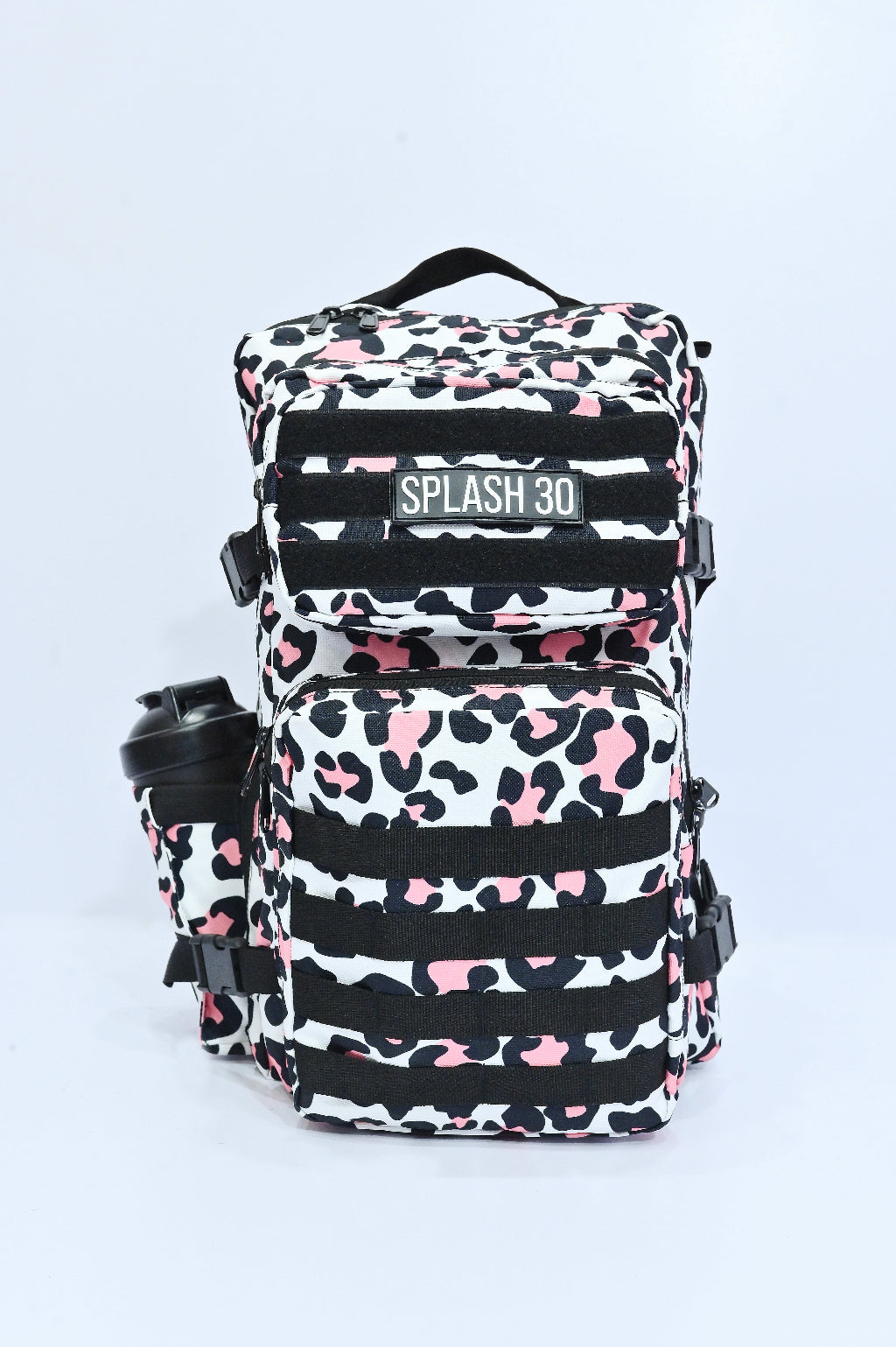 Backpack with pink and black pattern on a light gray background