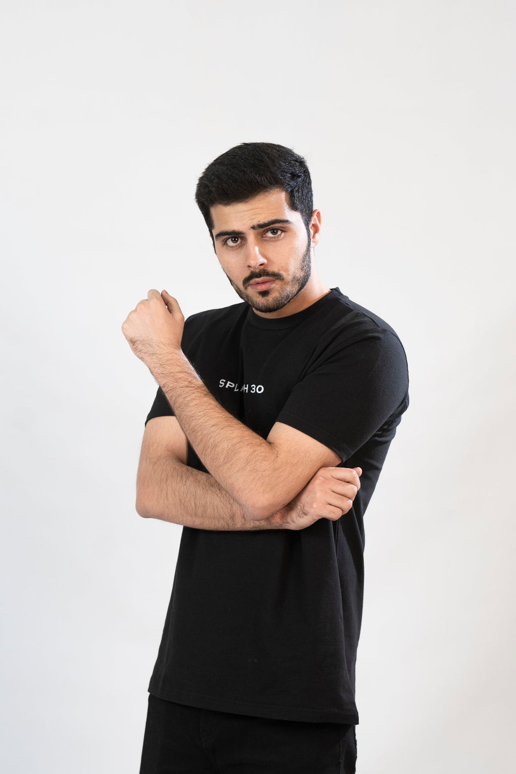 A man wearing a black t-shirt with a print of Khabib on the front.