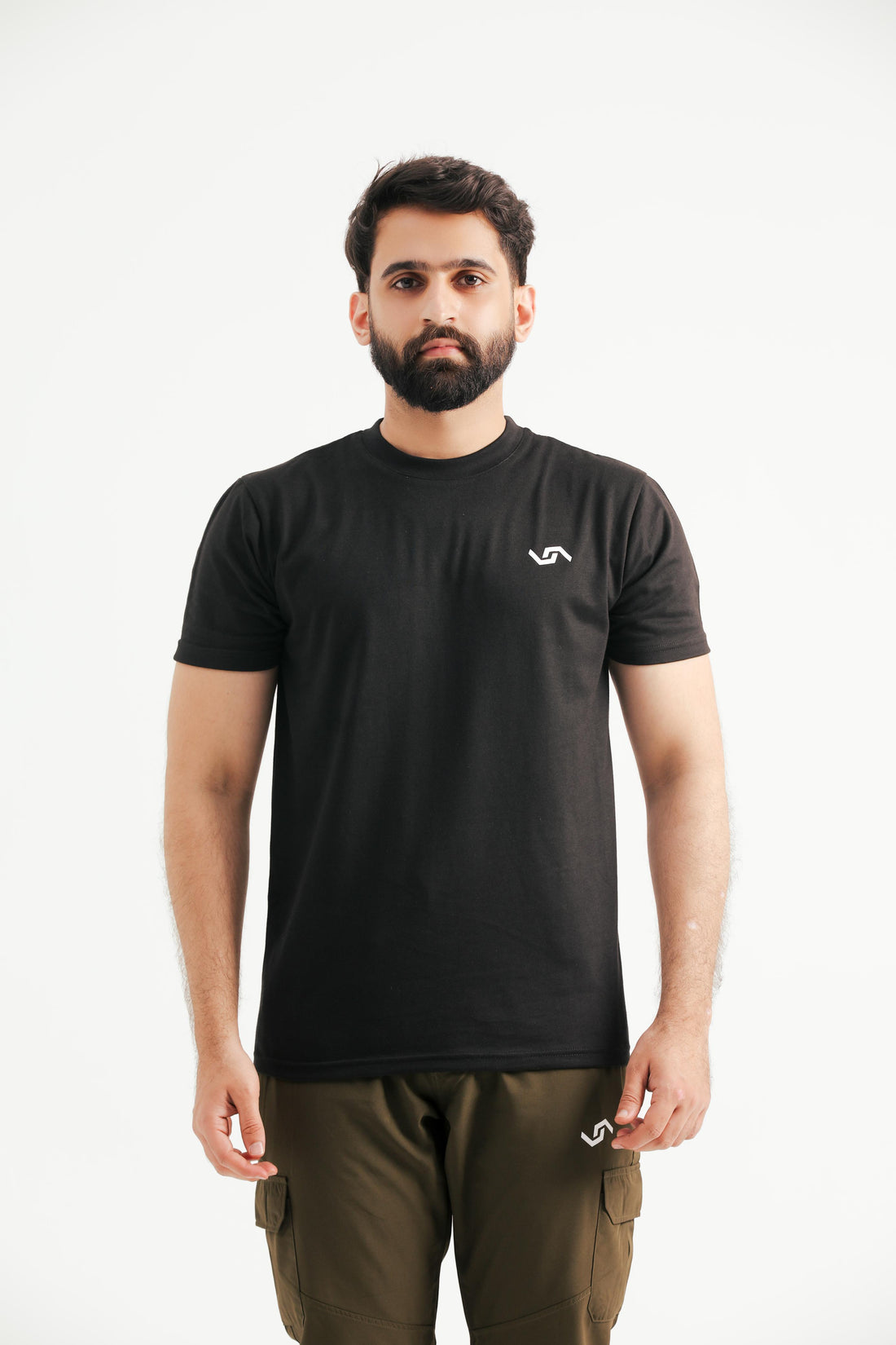 A person wearing a black T-shirt with 'splash' written across the front and the phrase 'strength lives here' around a globe design.