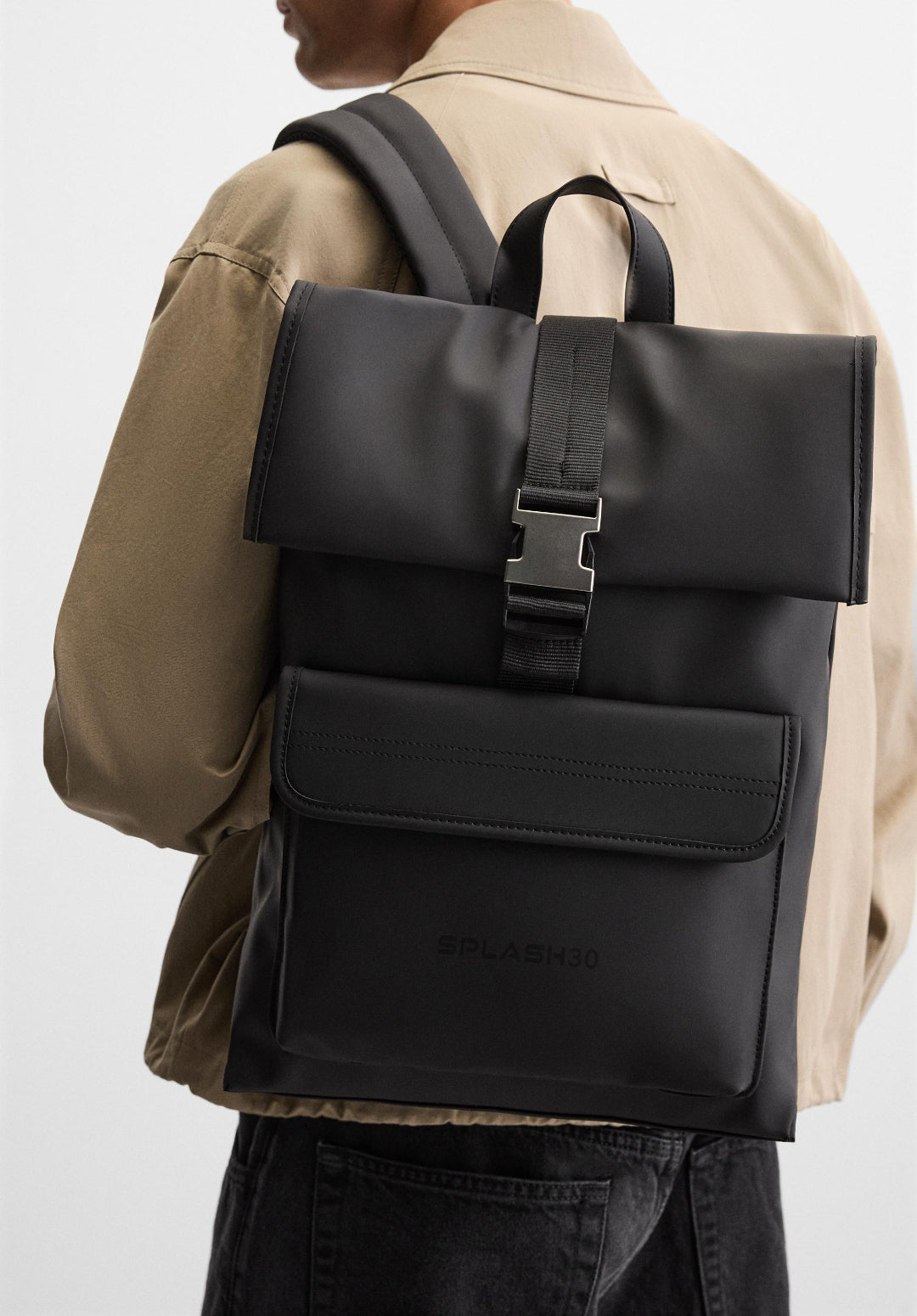 Black backpack with a brand logo on a light gray background