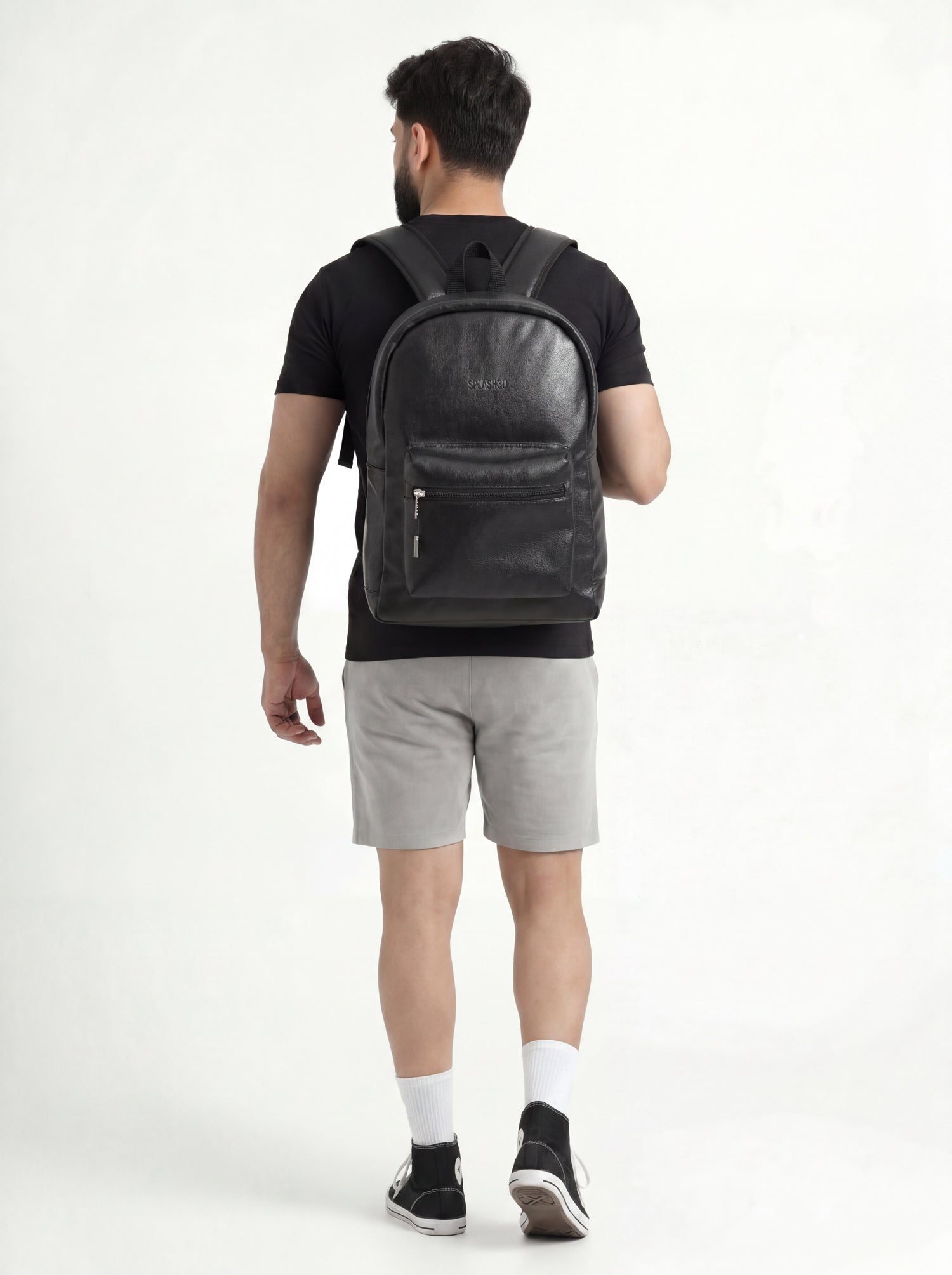 Man wearing Splash30 Black Leather Backpack 30L lifestyle side view