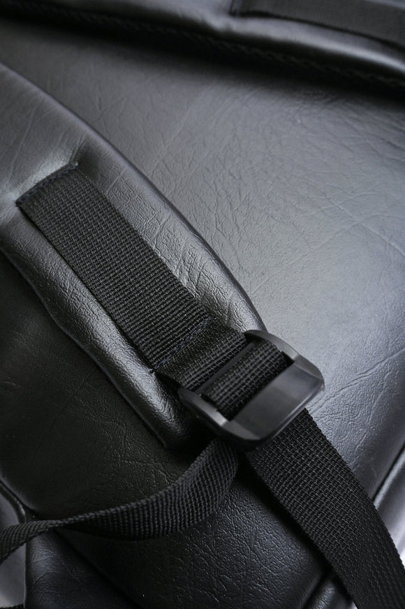 Close-up of adjustable shoulder strap buckle on Splash30 black leather backpack
