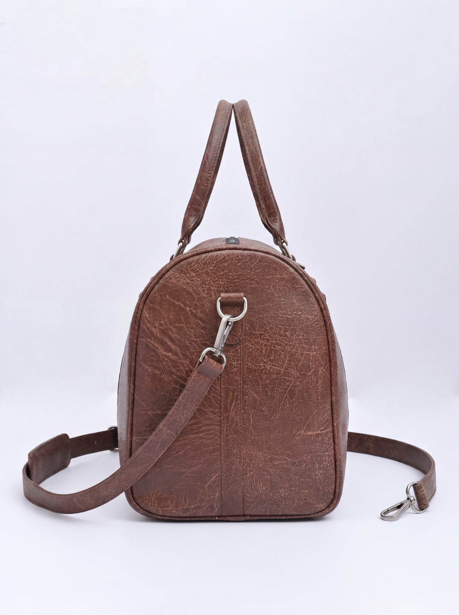 Splash30 Brown Leather Duffle Bag 40L back view showing detachable shoulder strap and silver clasp hardware
