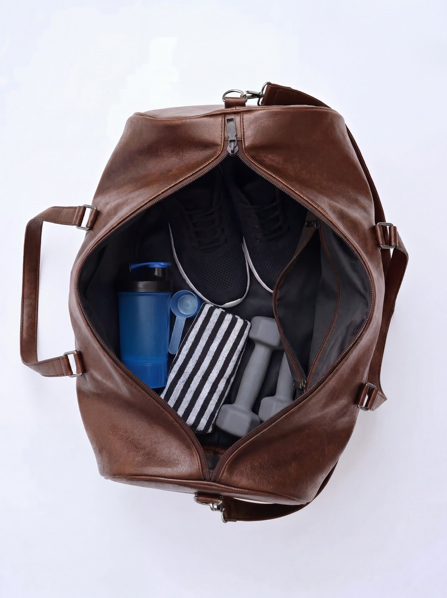 Splash30 Brown Leather Duffle Bag 40L open top view showing interior packed with gym bottle, resistance bands and shoes