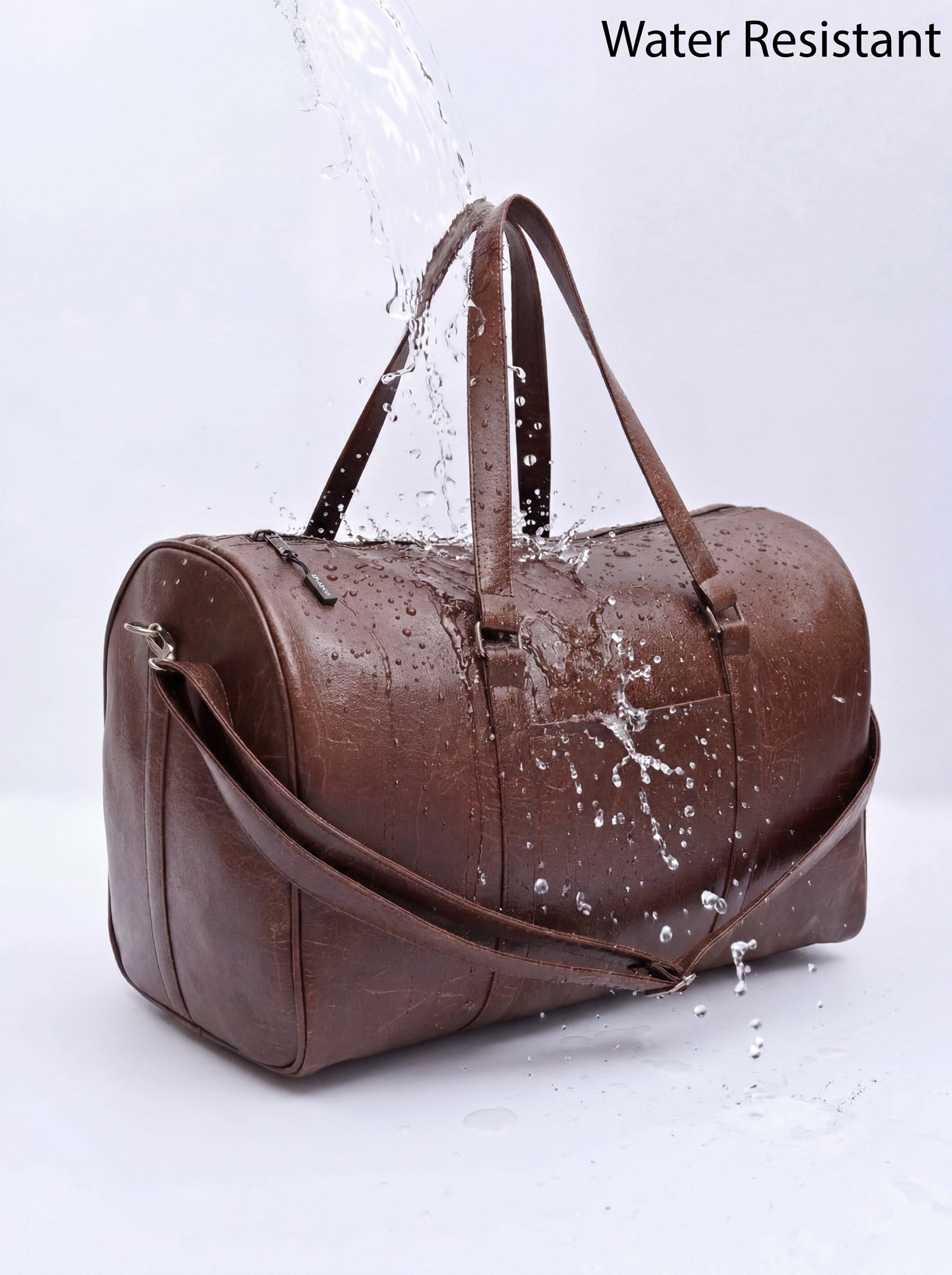 Splash30 Brown Leather Duffle Bag 40L water resistant test with water splashing on PU leather surface