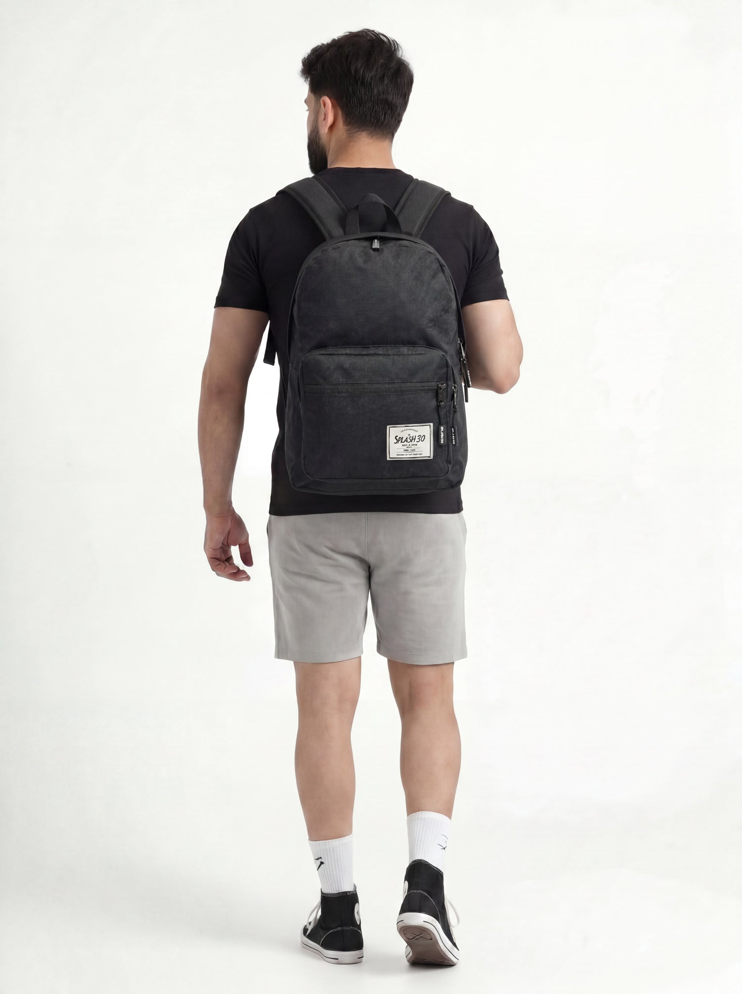 Person wearing Splash30 Classic Backpack 30L Raven Black lifestyle side view