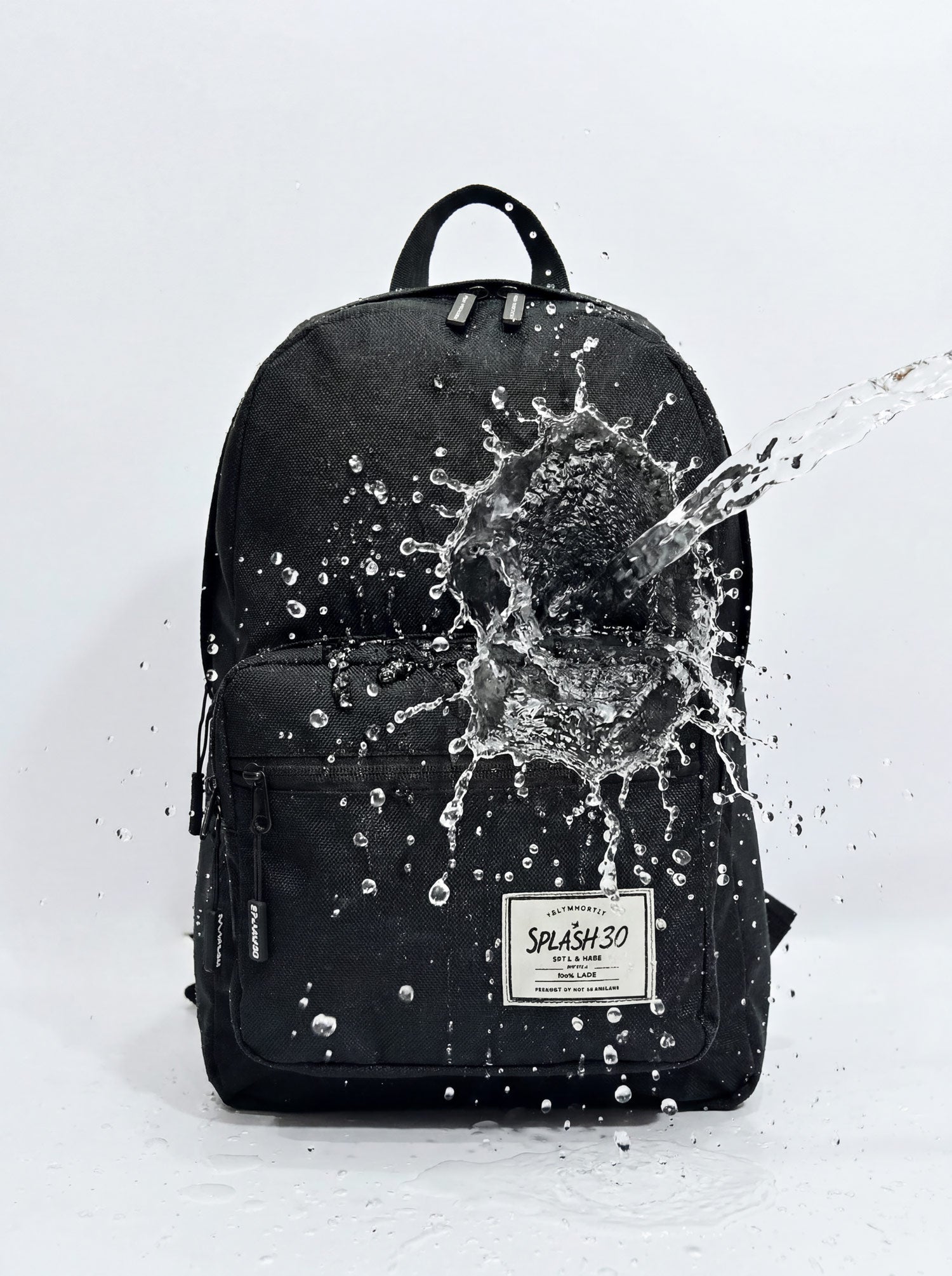 Splash30 Classic Backpack 30L Raven Black water resistant test with water splashing on recycled 600D polyester