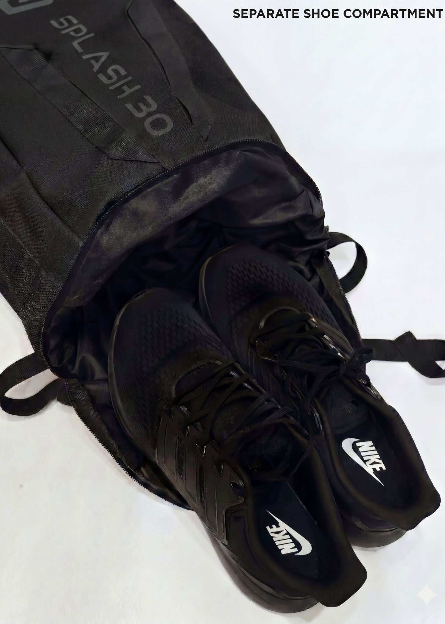Black Splash 30 Everyday backpack with shoes stored in the separate shoe compartment — a dedicated pocket for shoes or laundry