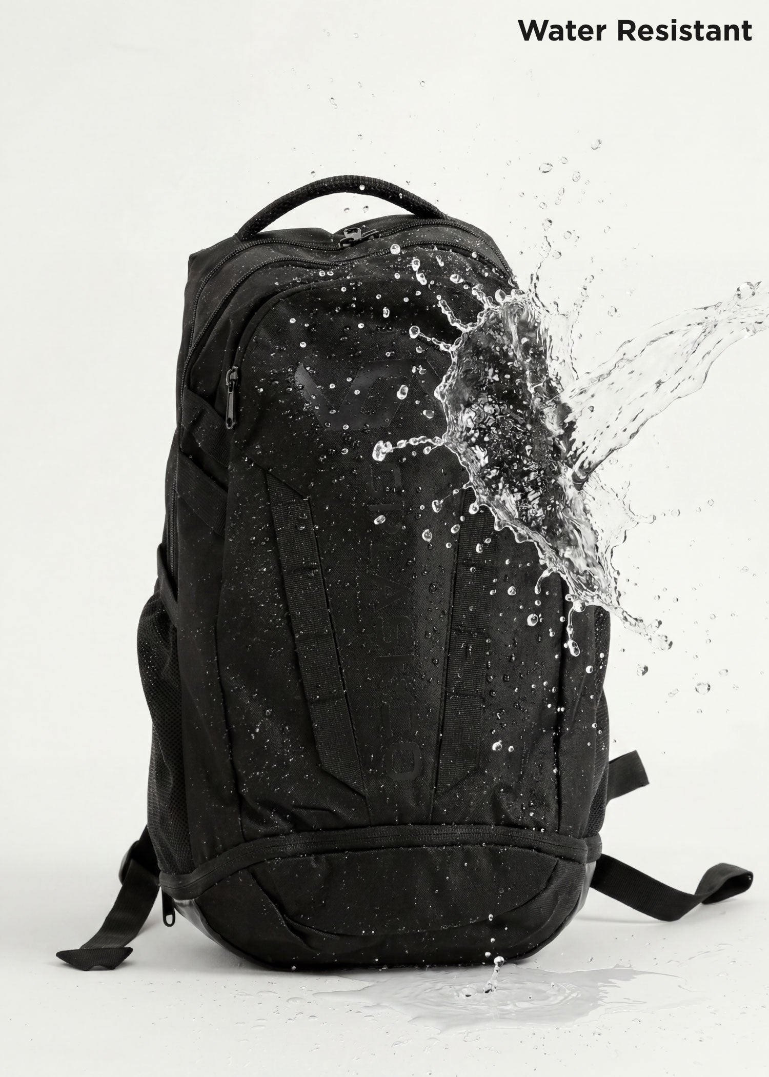 Black Splash 30 Everyday backpack with water splashing on it, demonstrating the water-resistant fabric — keeps essentials dry