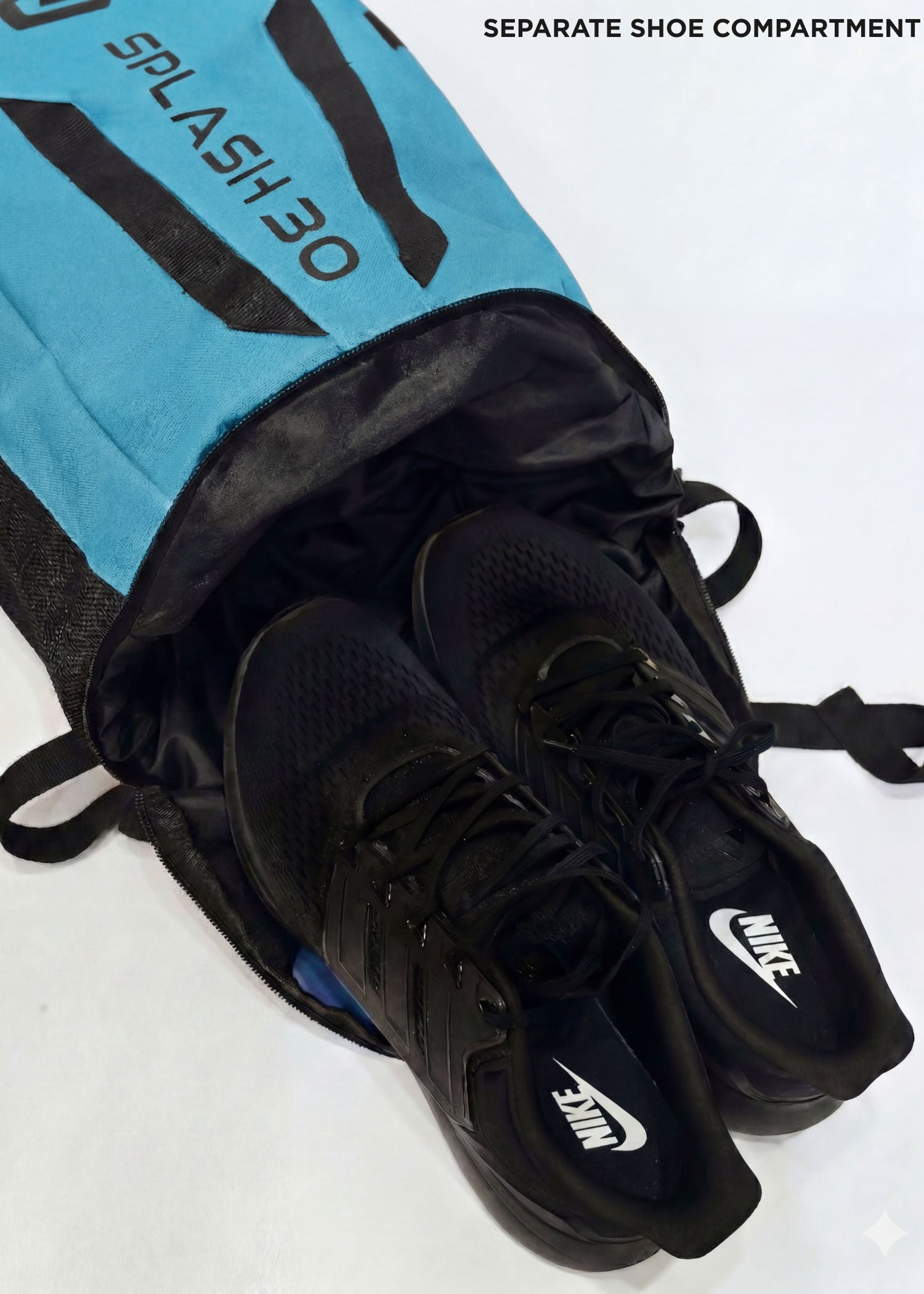 Blue Splash 30 Everyday backpack with shoes stored in the separate shoe compartment — a dedicated pocket for shoes or laundry