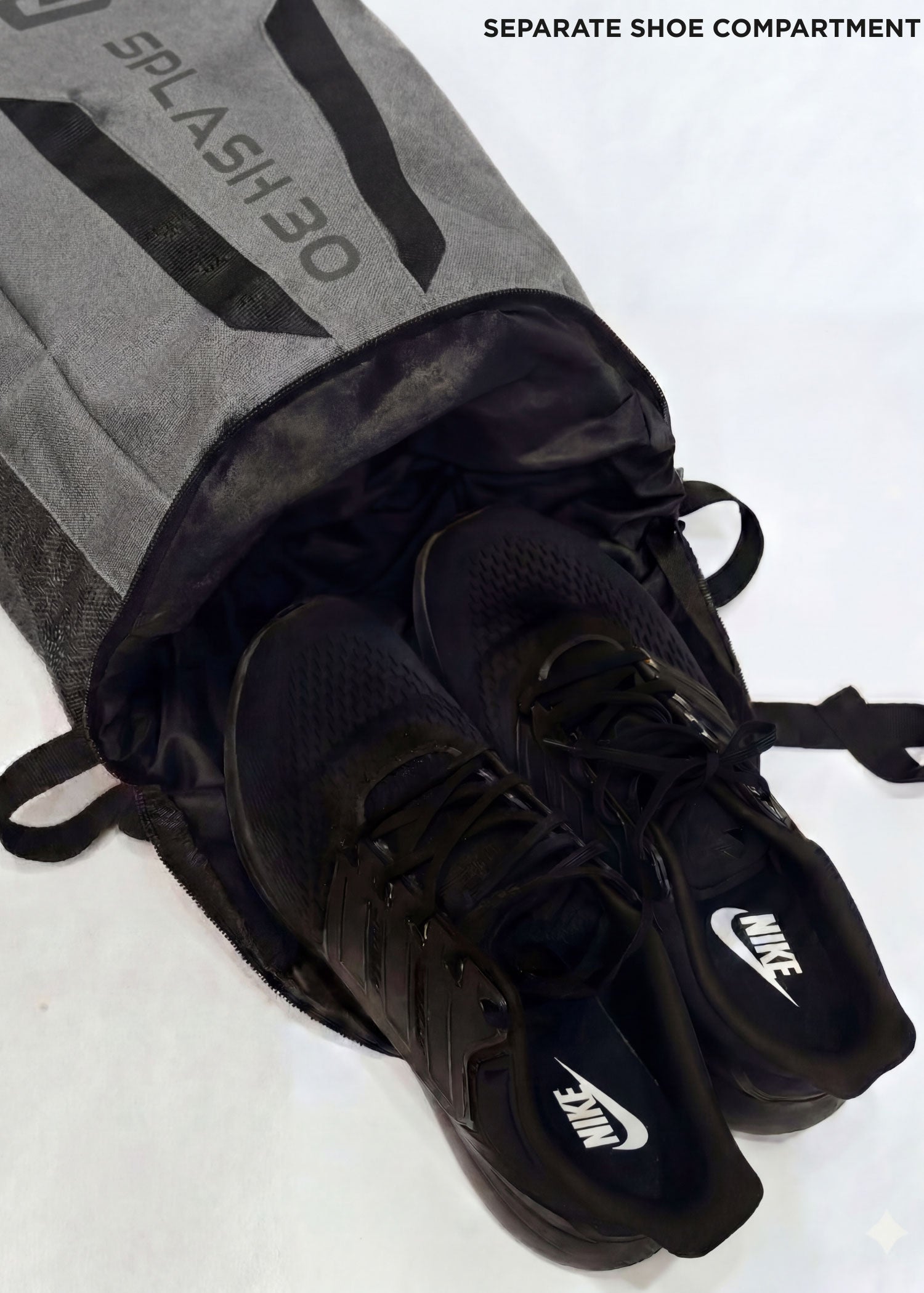 Gray Splash 30 Everyday backpack with shoes stored in the separate shoe compartment — a dedicated pocket for shoes or laundry