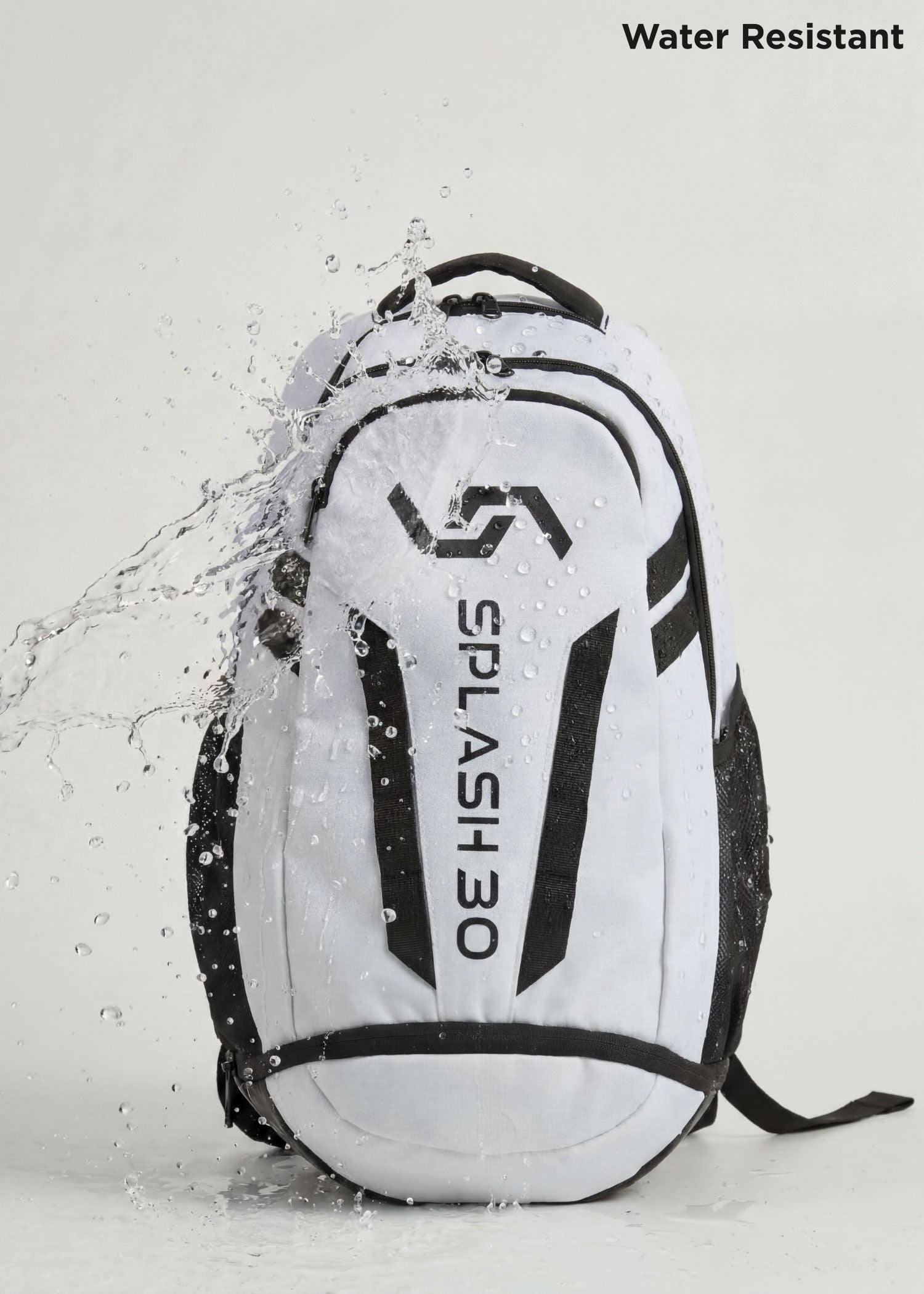 White Splash 30 Everyday backpack with water splashing on it, demonstrating the water-resistant fabric — keeps essentials dry