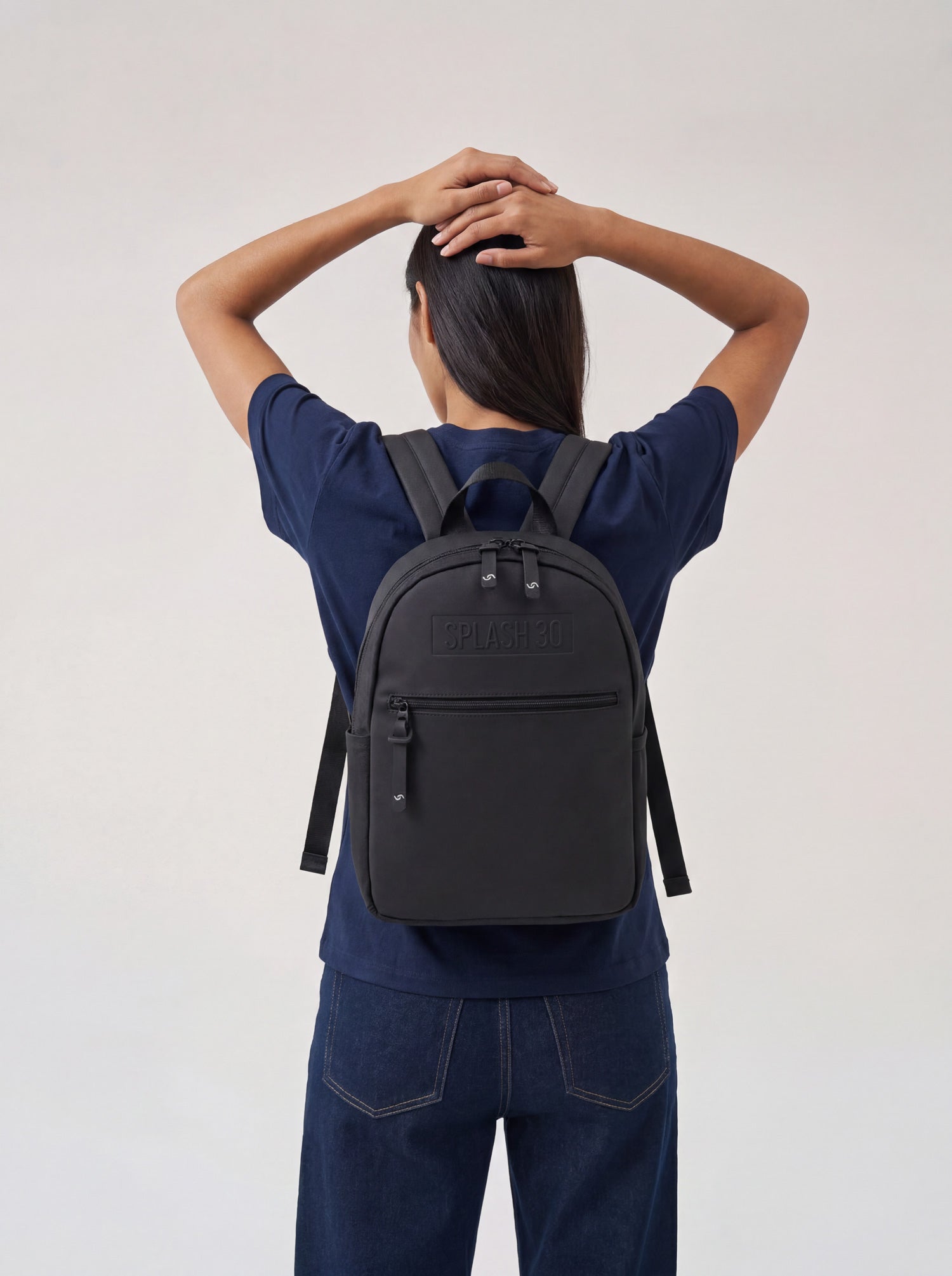 Person wearing Splash30 Everyday Mini Backpack 8L black lifestyle back view