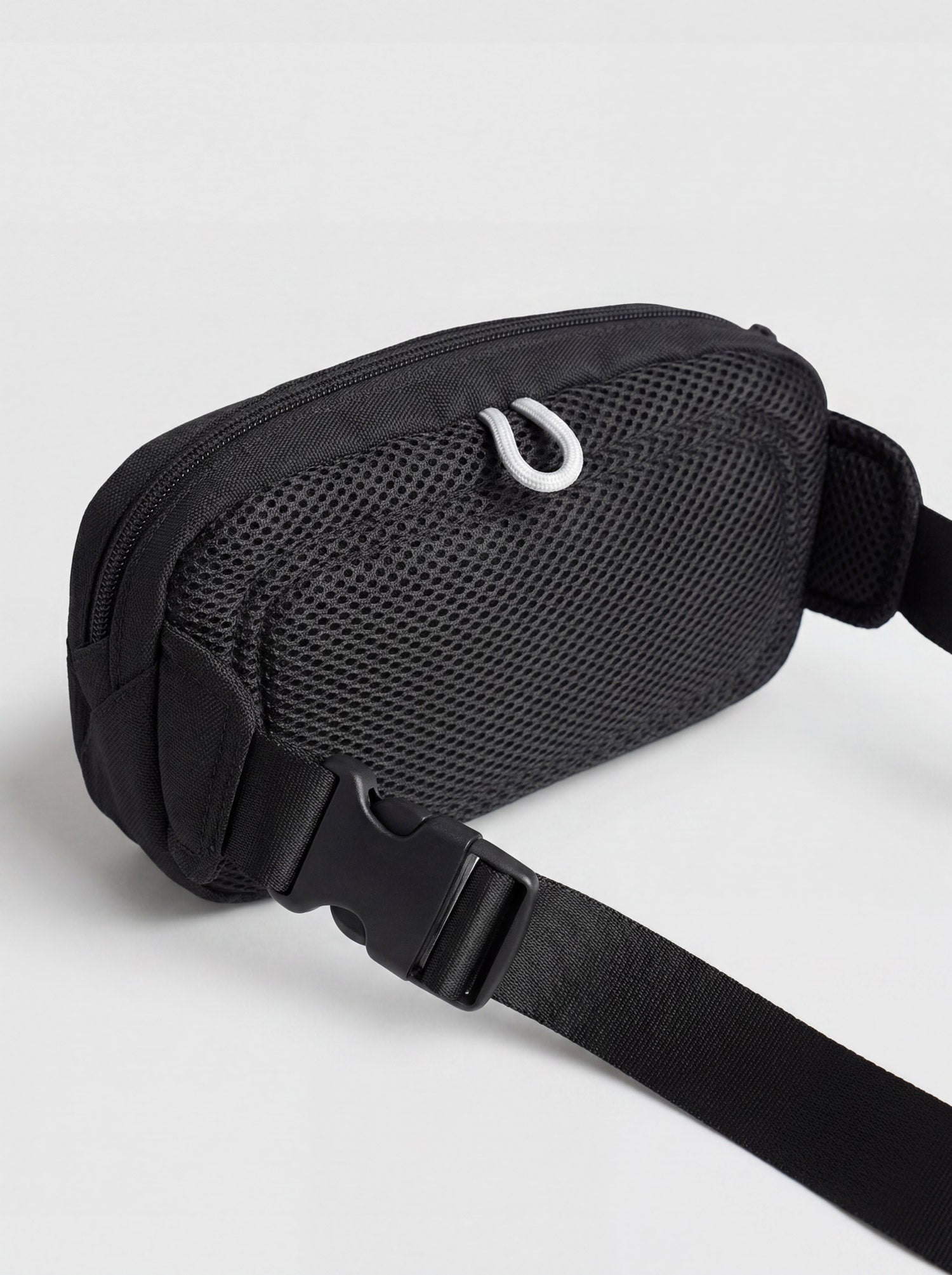 Close-up of adjustable strap and side release clip on Splash30 black waist pack