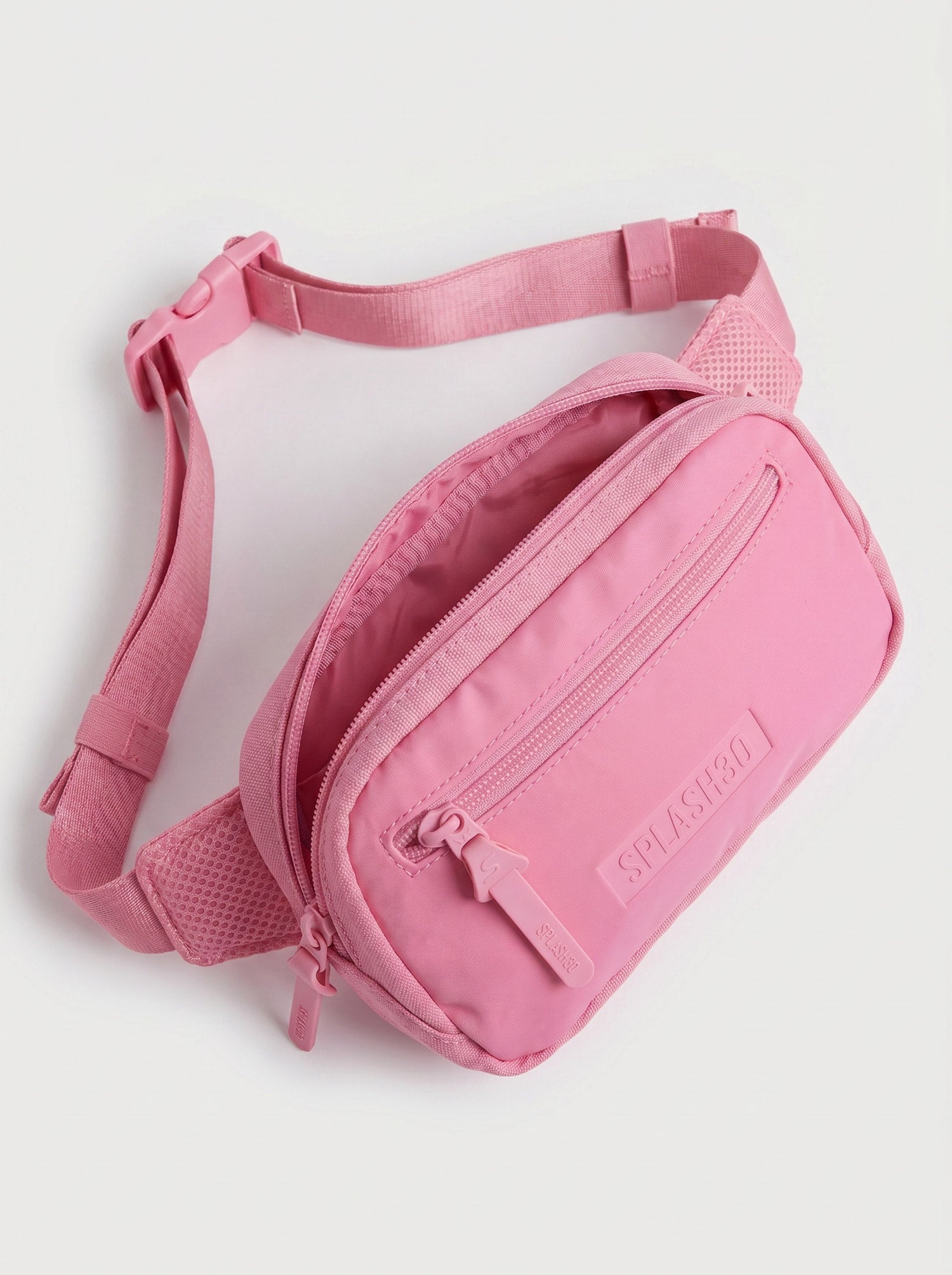 Splash30 Everyday Waist Pack pink angled view showing adjustable strap and zip compartments