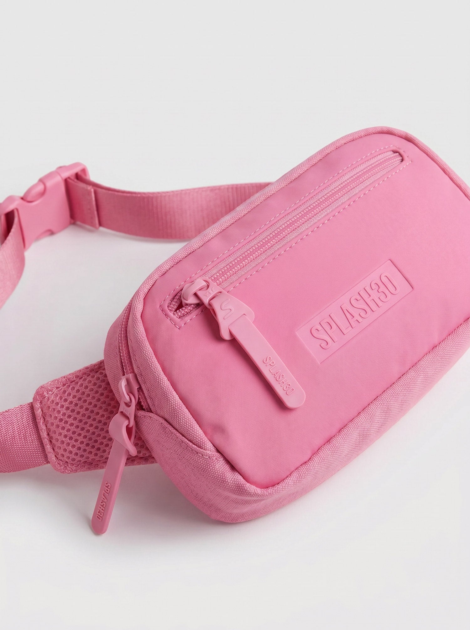 Splash30 Everyday Waist Pack pink front view showing embossed logo on matte PVC