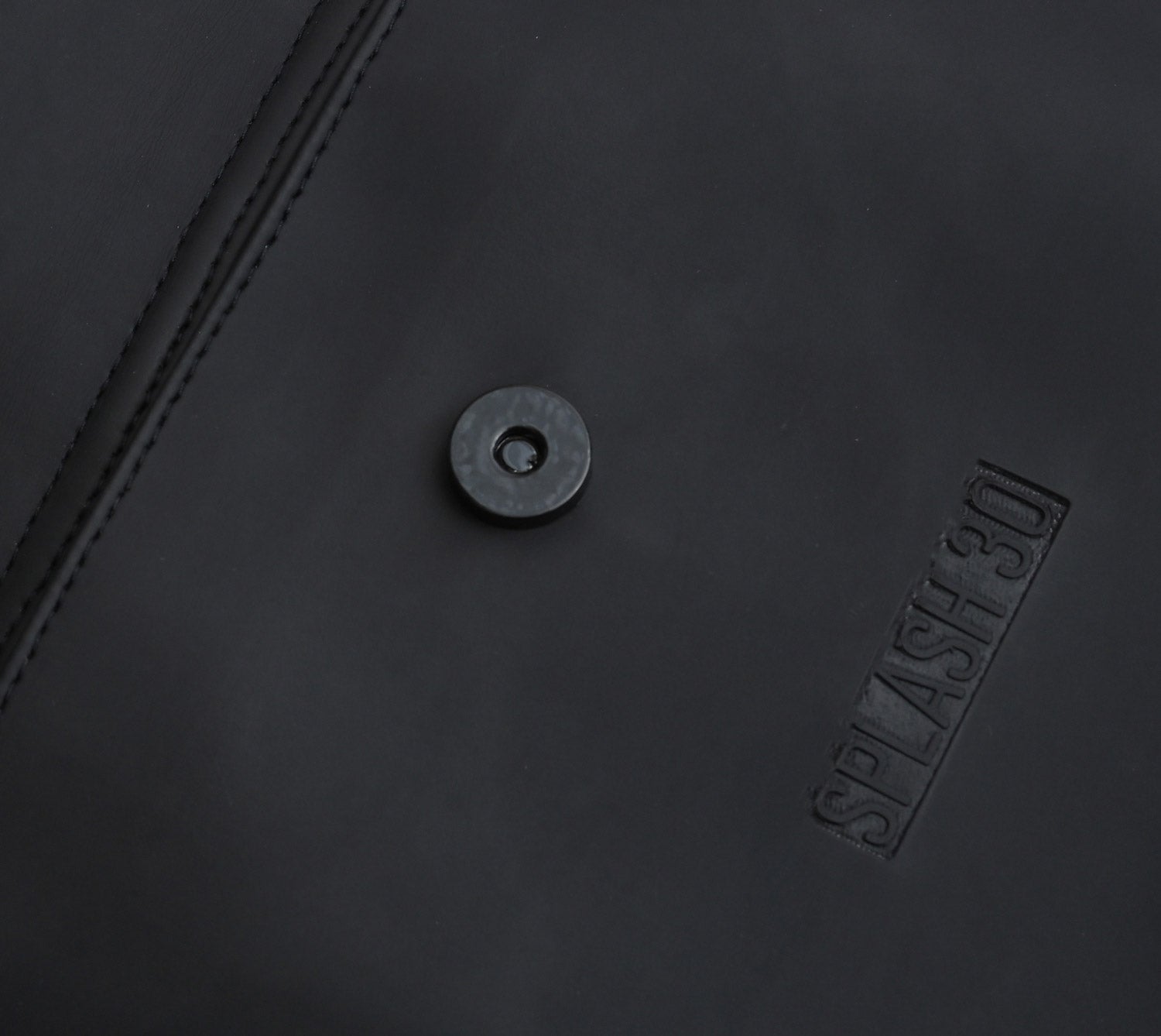 Close-up of magnetic clasp detail on Splash30 Urban Rubberized Backpack black